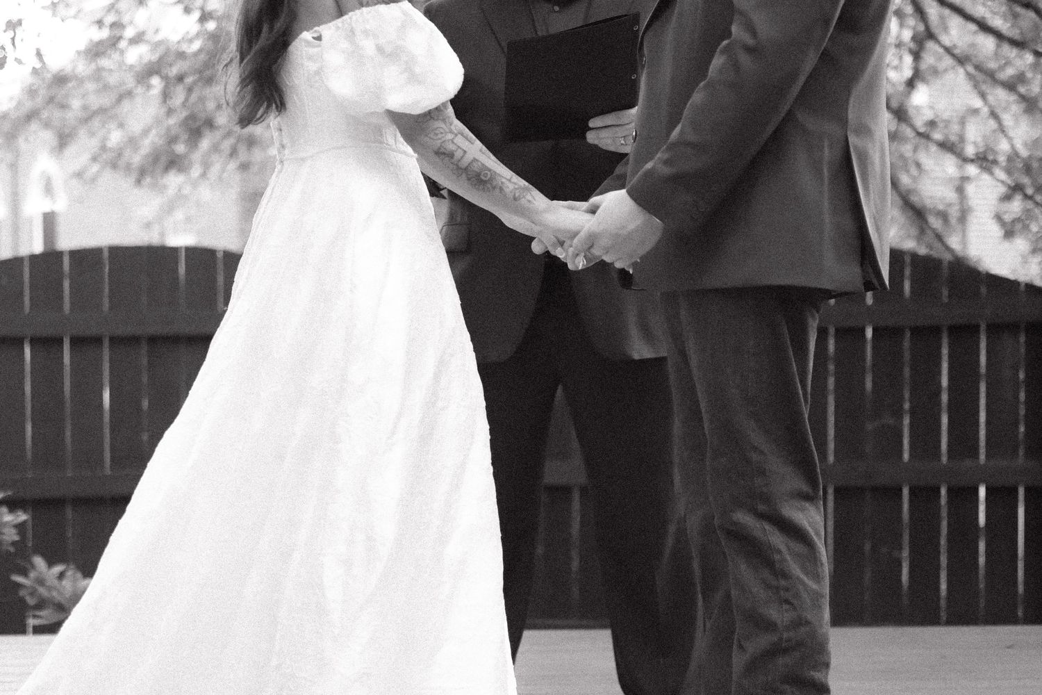 Black and white wedding photos showing intimate moments between newlyweds.