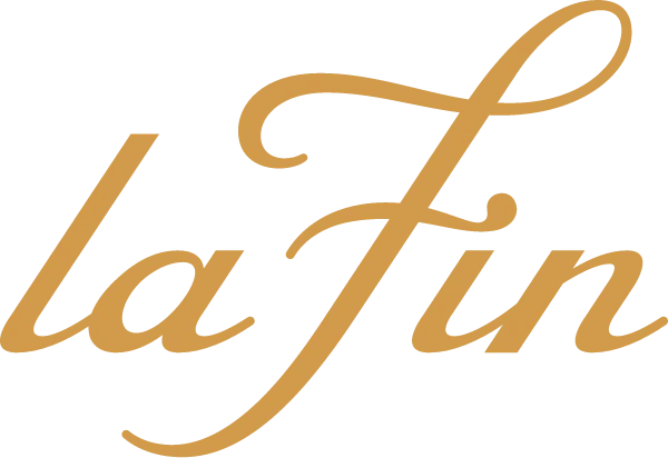 La Fin elegant gold cursive script logo on white background, luxury brand typography design.