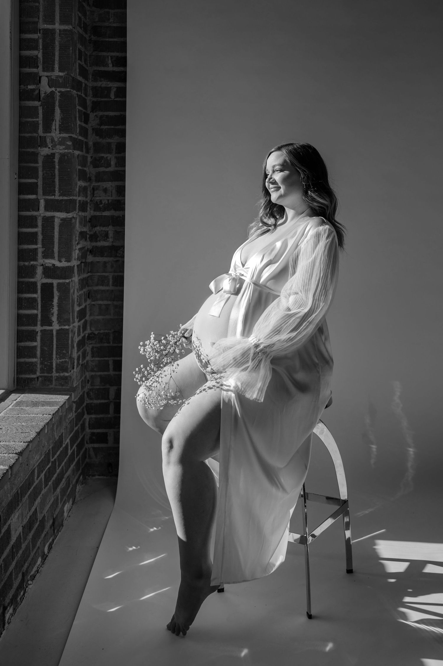 Maternity client portrait in a robe, black and white studio session at Afternoon Studios in Phoenix, AZ.