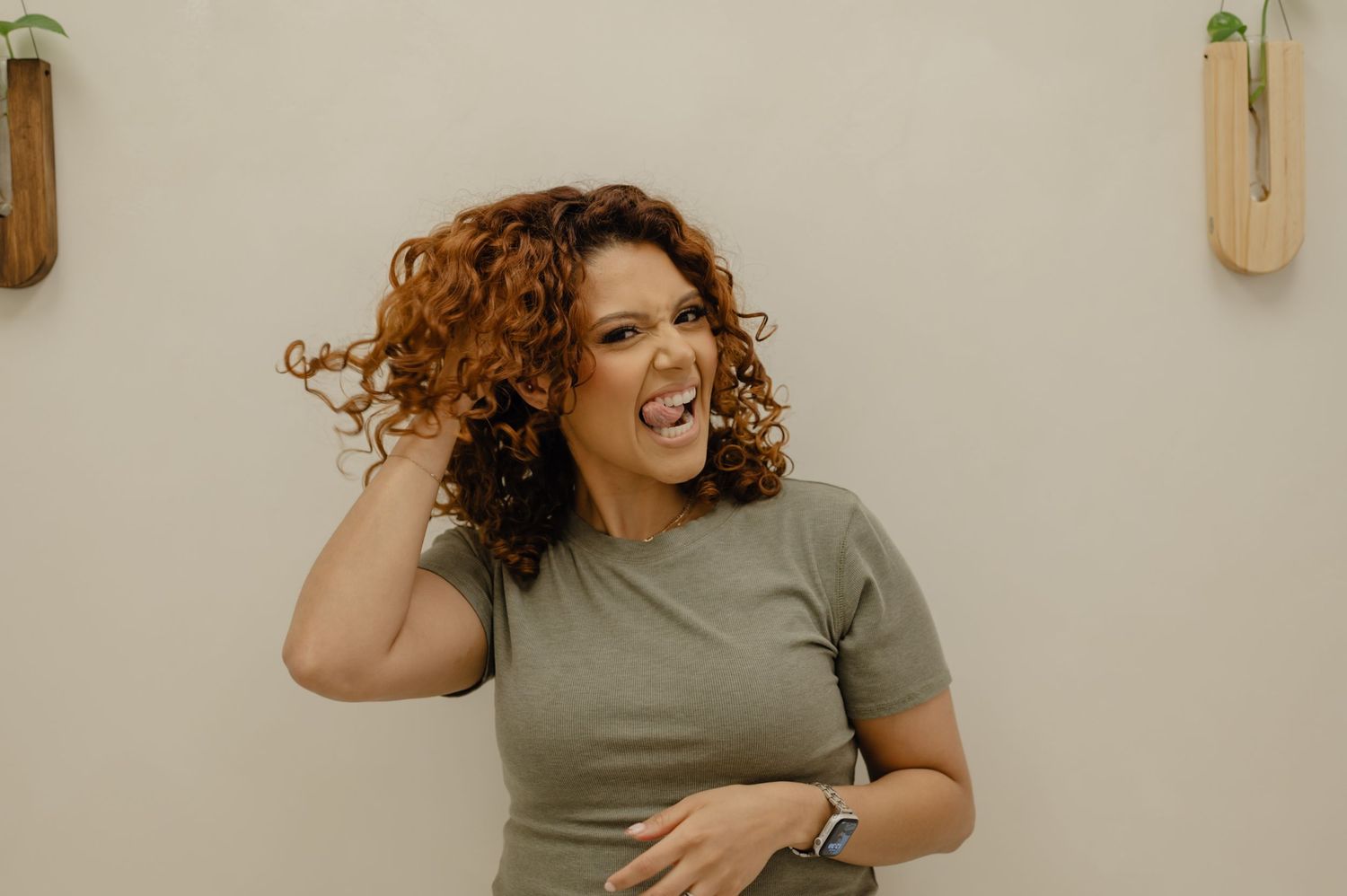 Serena Beach smiling in salon—curl specialist known for healthy hair transformations and curly confidence at Salon Blissful.