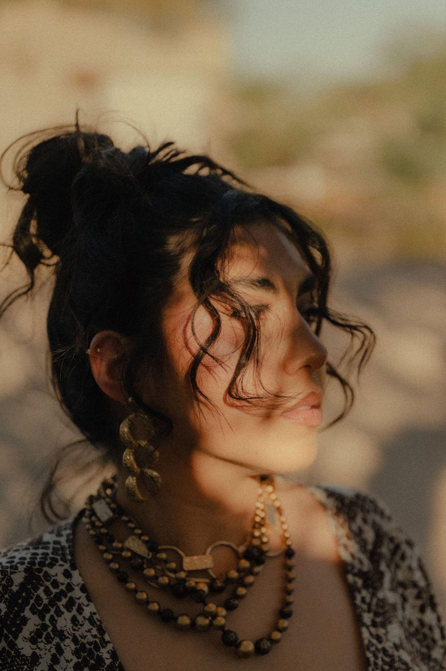 Brand photo of Amariz Jones, founder of The Hive salon in Phoenix, captured with warm light and natural styling.