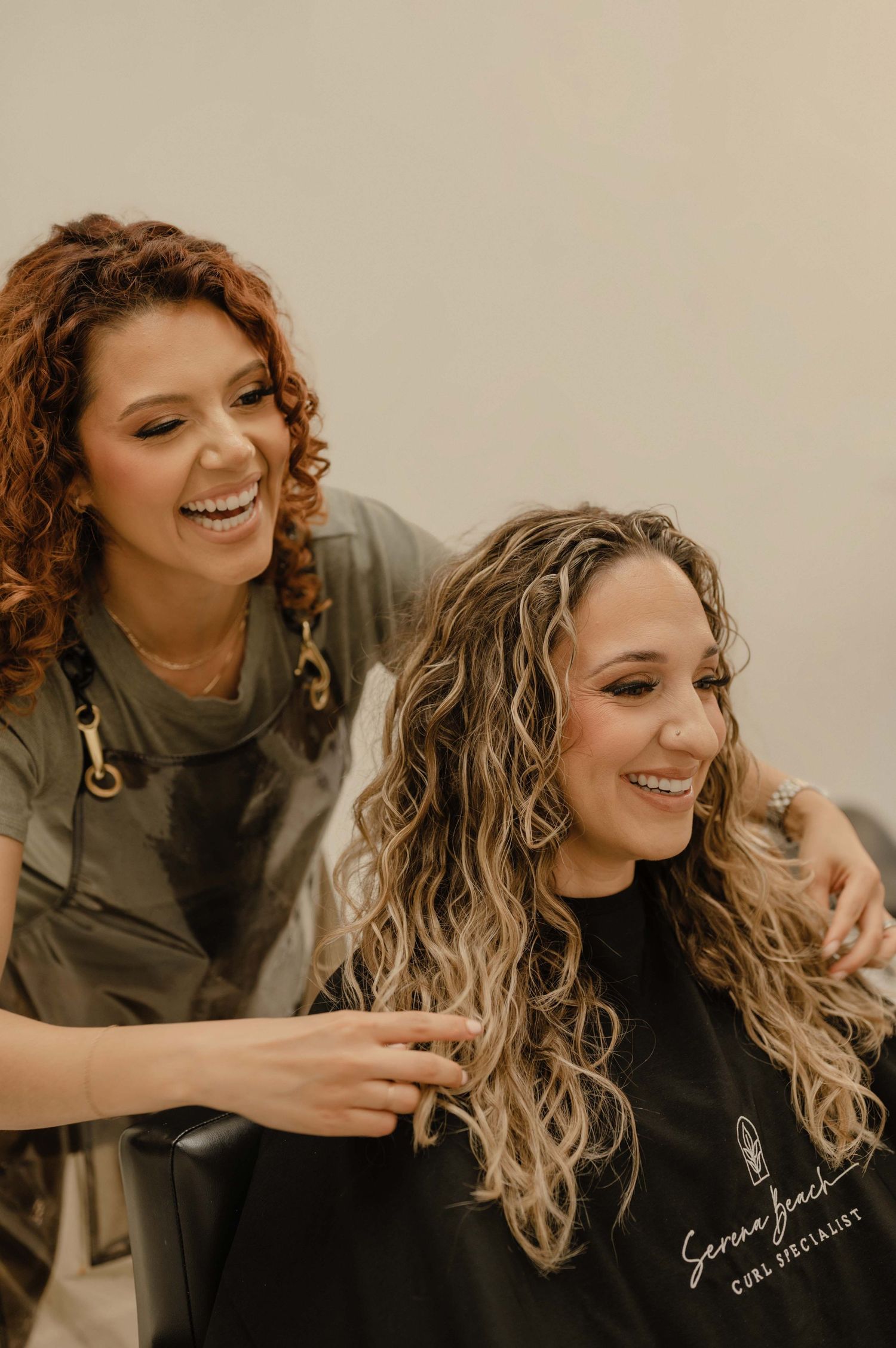 Phoenix hairstylist showing a client her finished hair in the mirror during a branding session