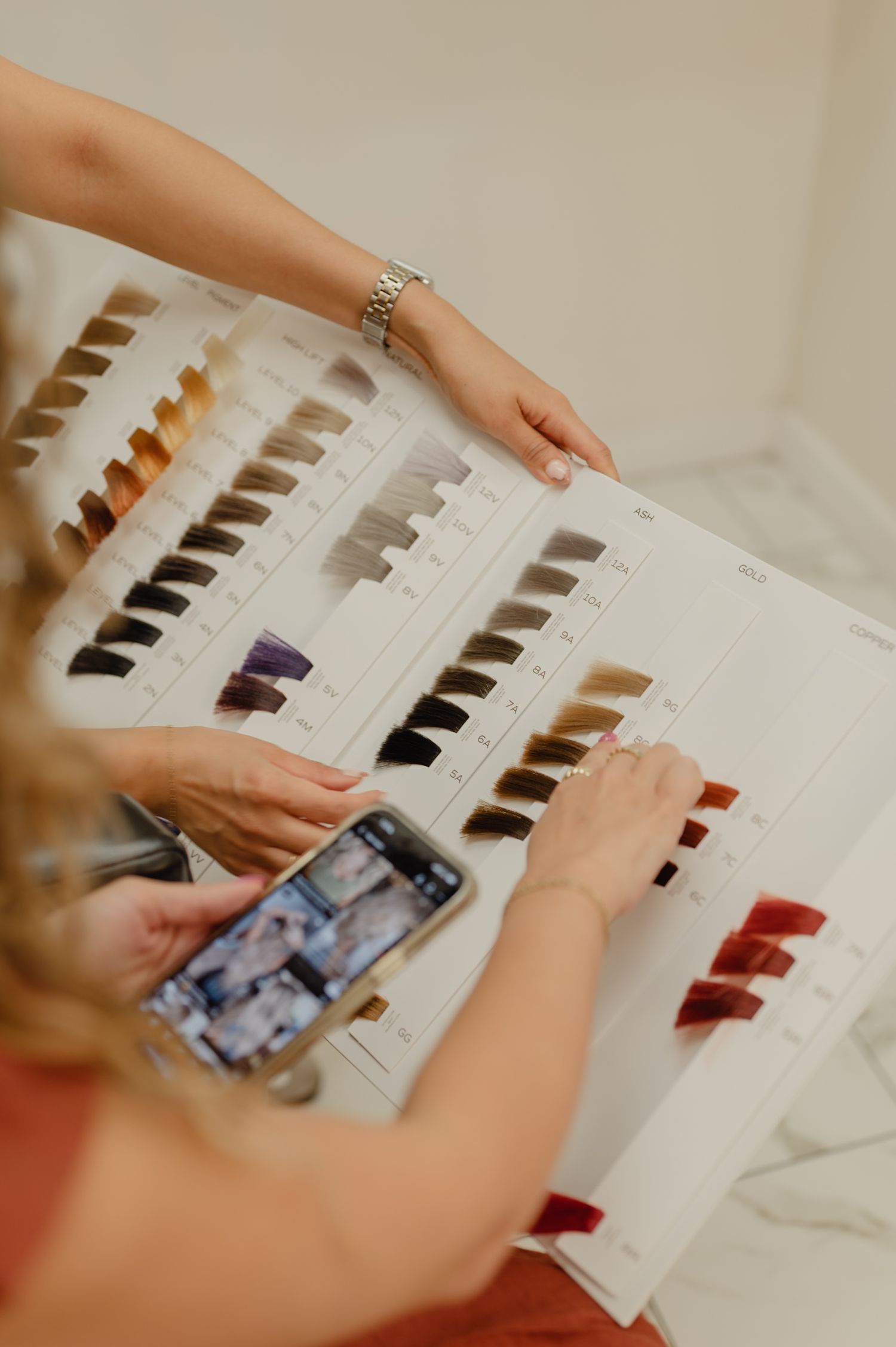 Custom color matching for curly clients—Serena Beach selects vibrant, curl-safe tones at Salon Blissful.