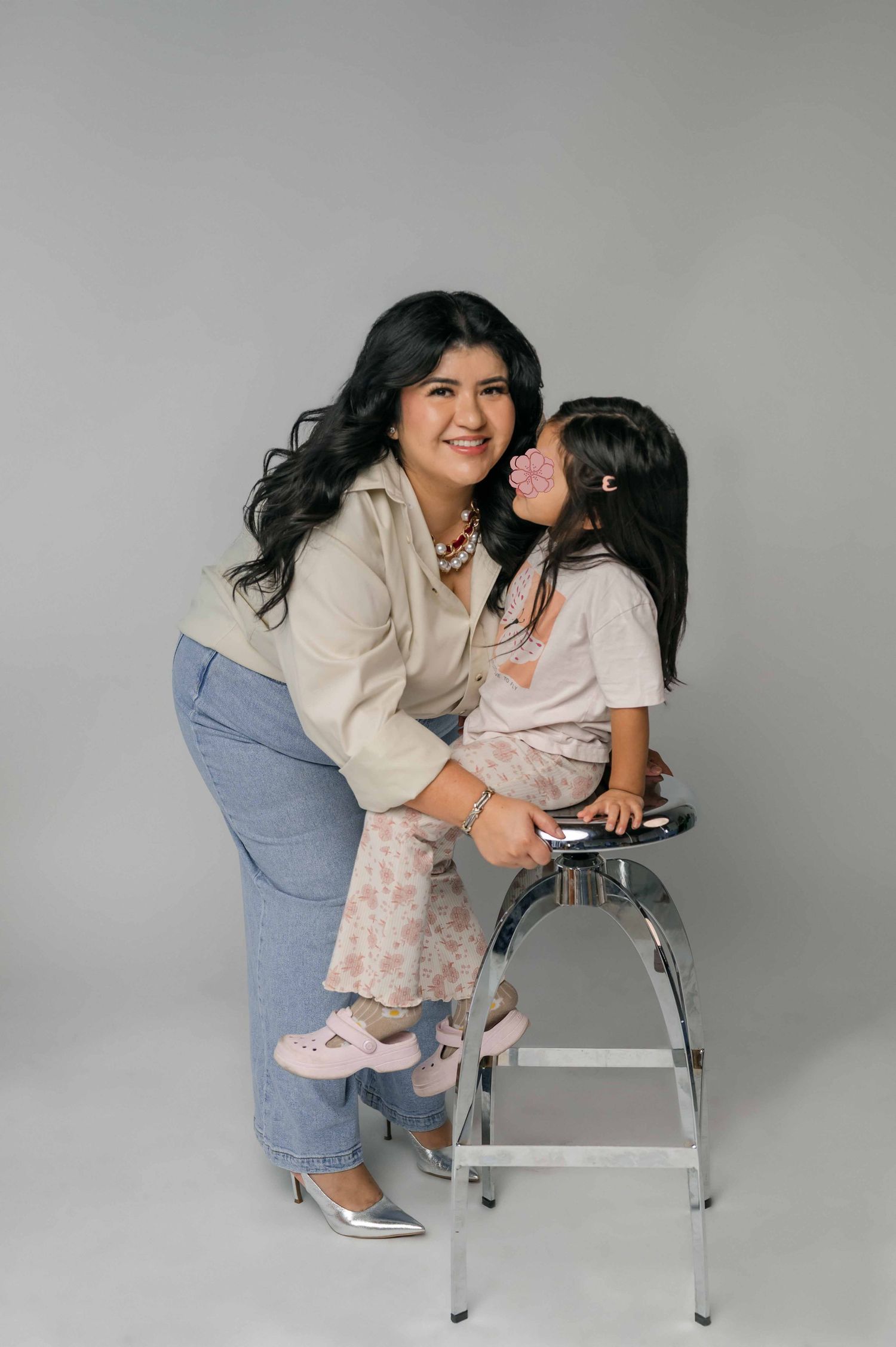 Sharom and daughter sharing a warm studio moment, representing the heart behind Shamari Visuals.