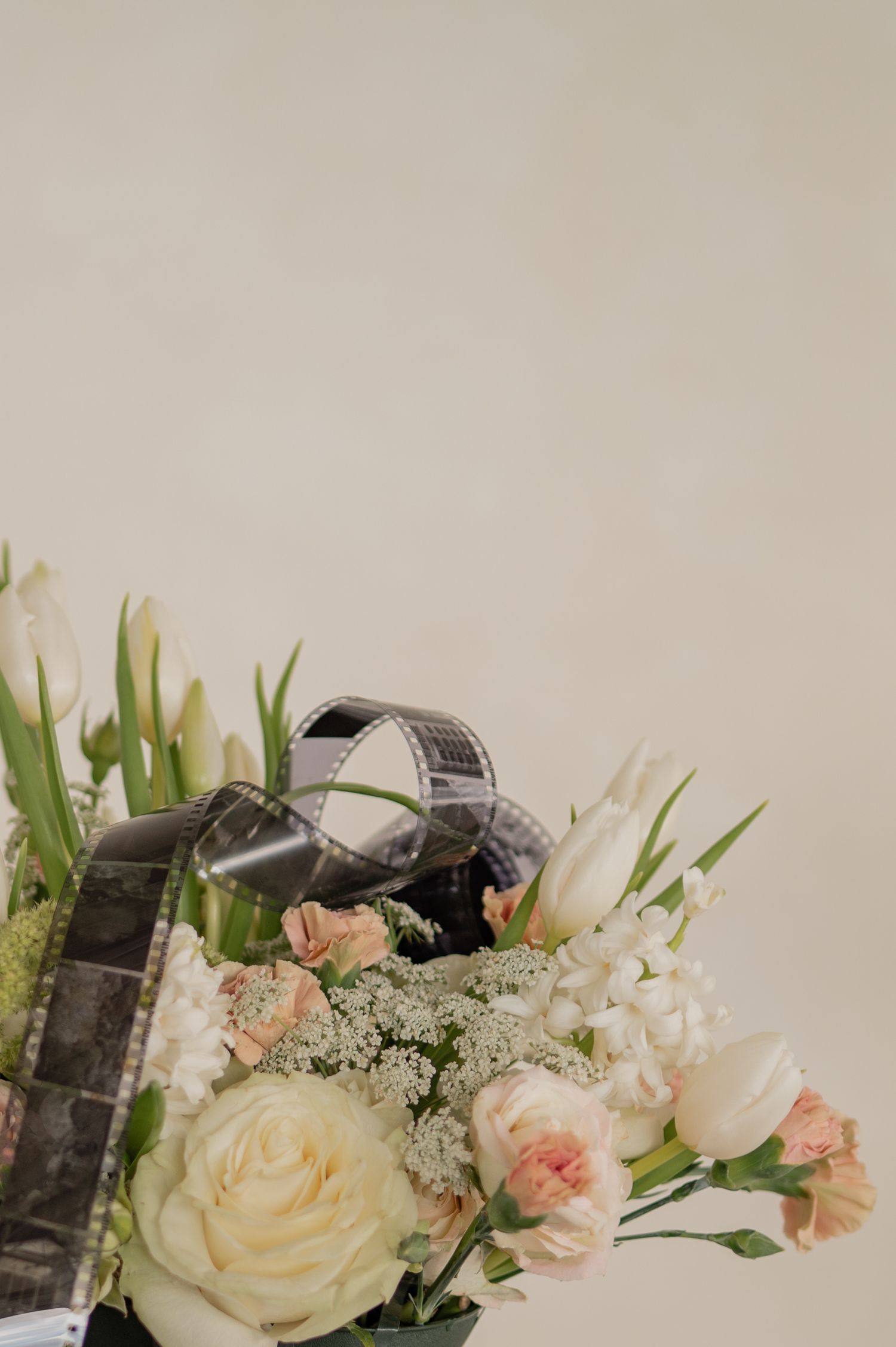 Flat lay of camera and flowers repeated — consistent aesthetic with romantic vintage vibes.