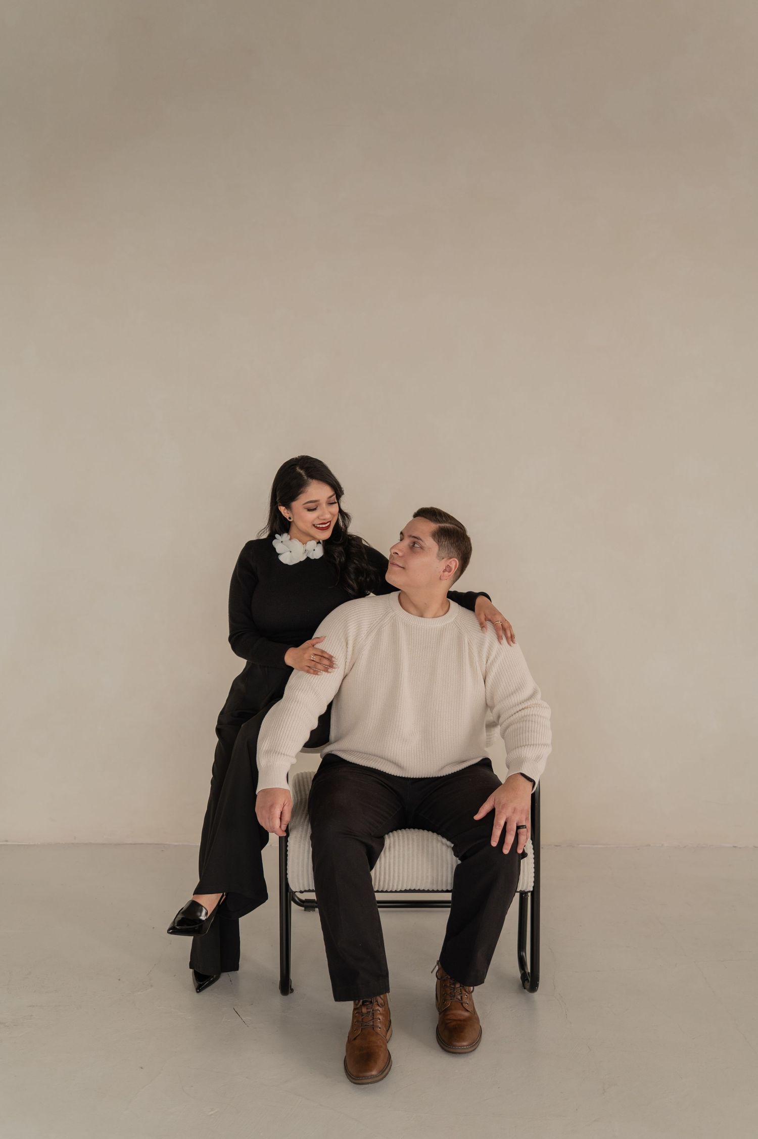 Full-length photo of the creative duo with simple neutral backdrop — clean, timeless branding.