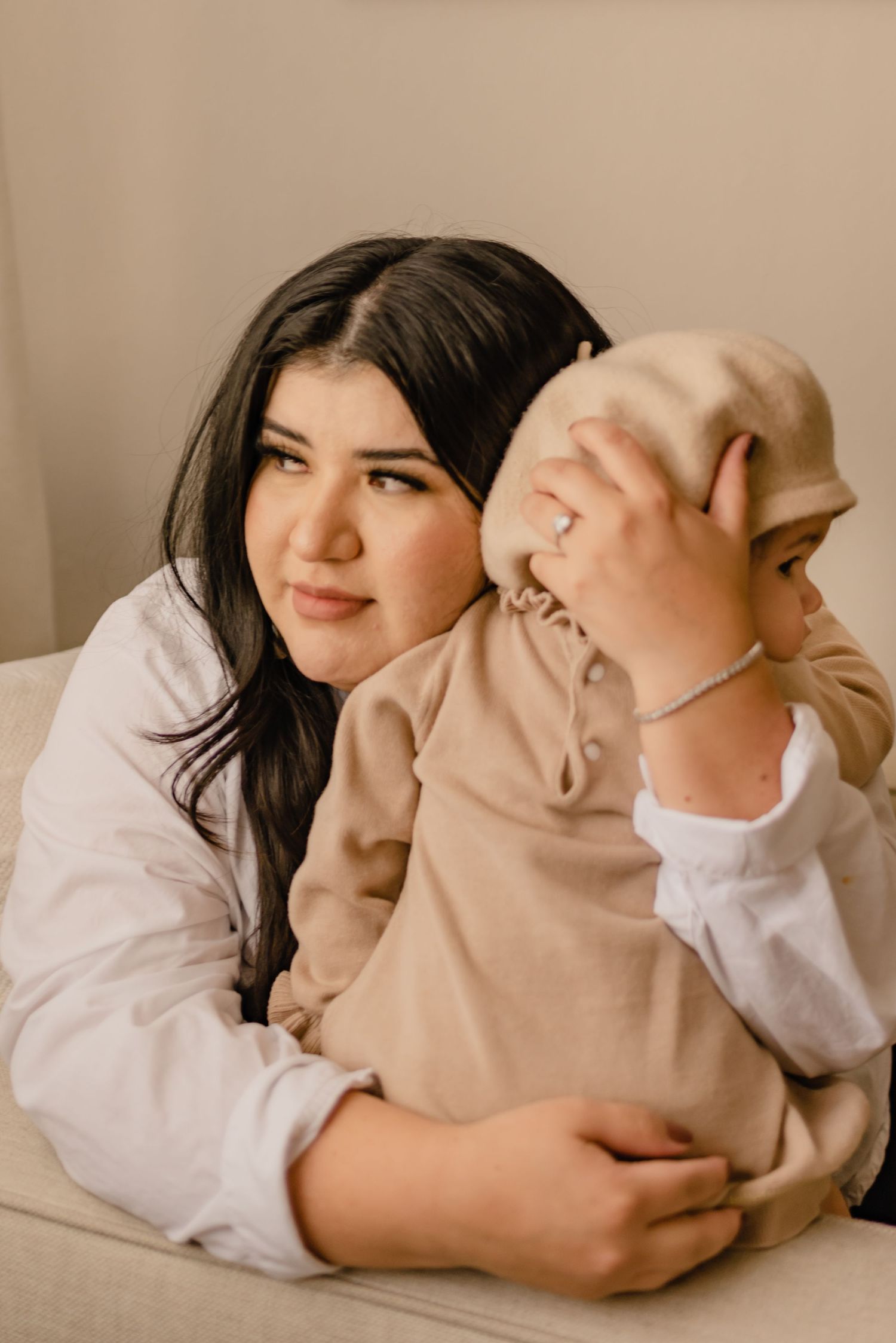 A mother embraces her daughter in a tender close up portrait, a candid family moment.