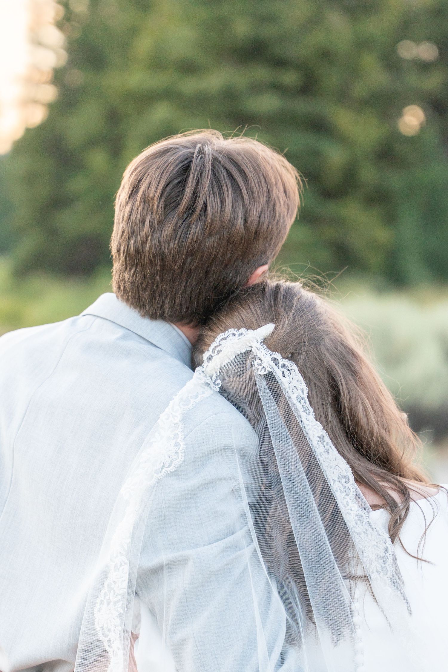 Soft focus wedding portrait showing couple's intimate moment.
