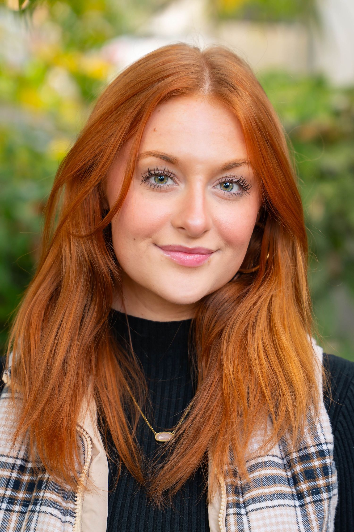 Series of portraits featuring vibrant red hair and plaid shirt against natural background.