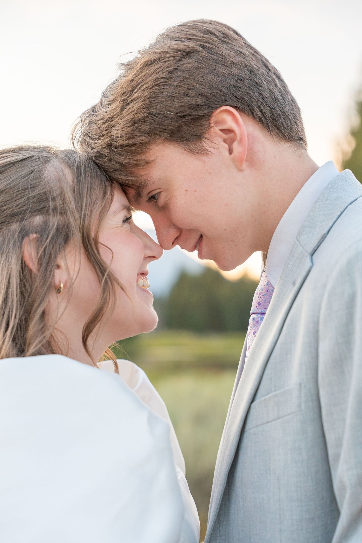 Intimate wedding portrait showing tender moments between newlyweds.