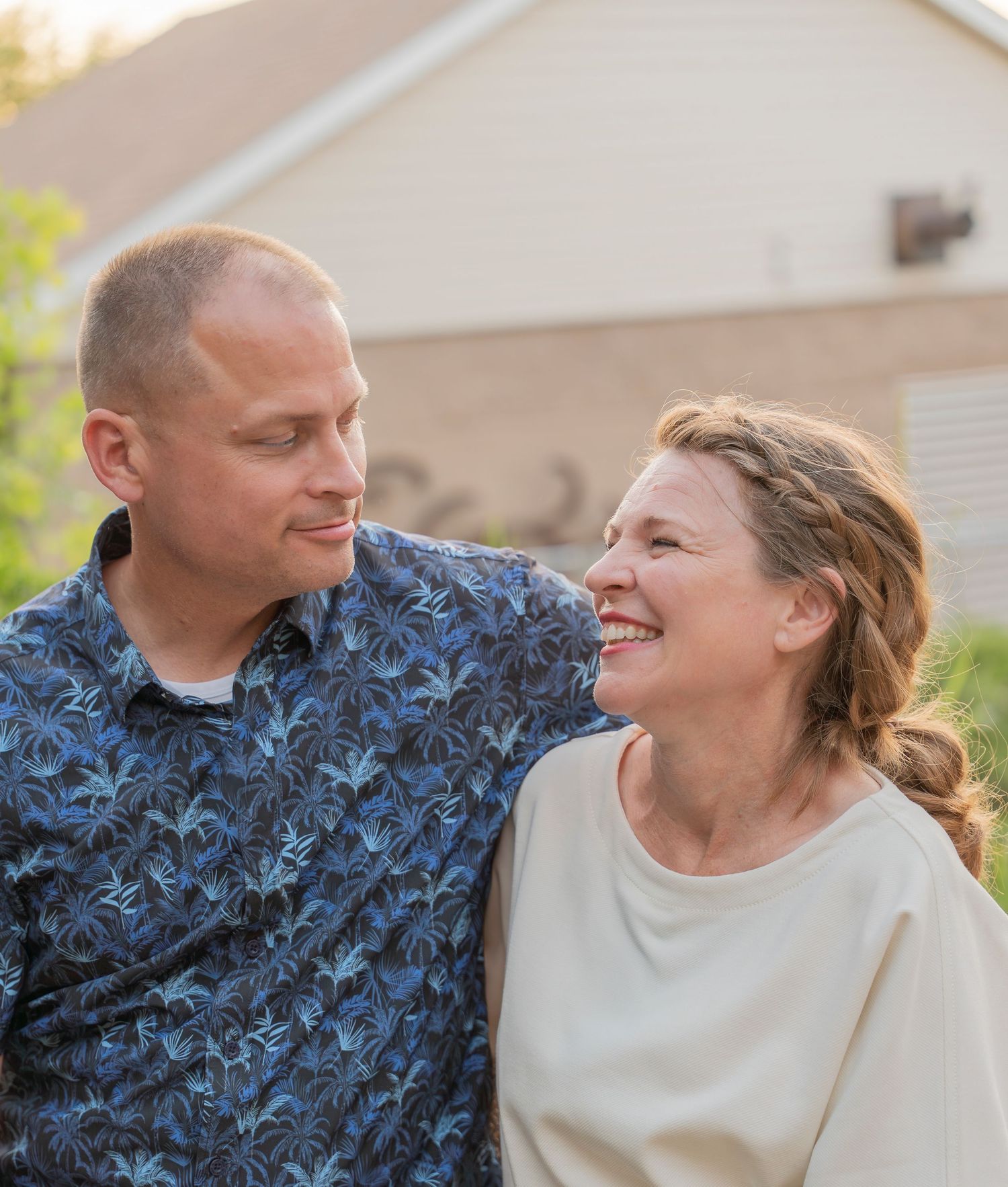 Couple in casual wear sharing intimate moments during golden hour.