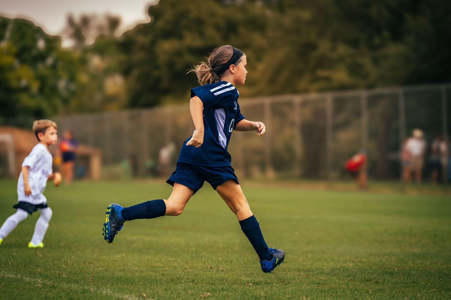 Action soccer photo capturing strength, motion, and determination on the field.
