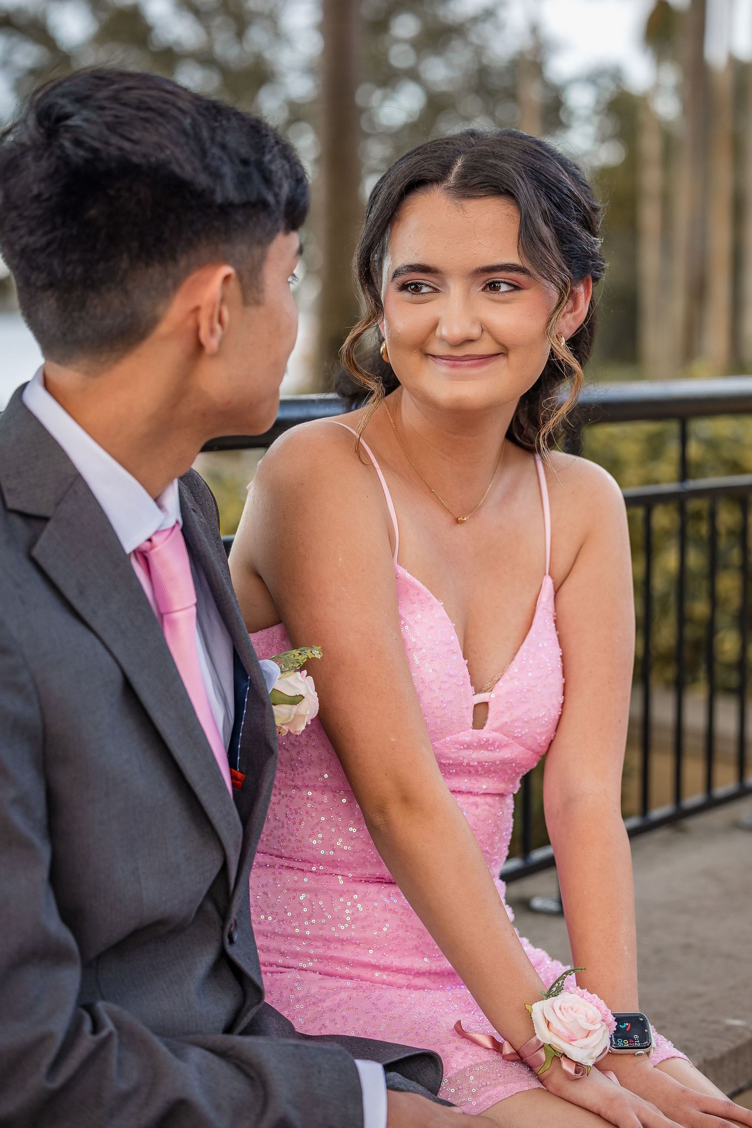 Elegant outdoor prom photo capturing true connection, style, and candid joy