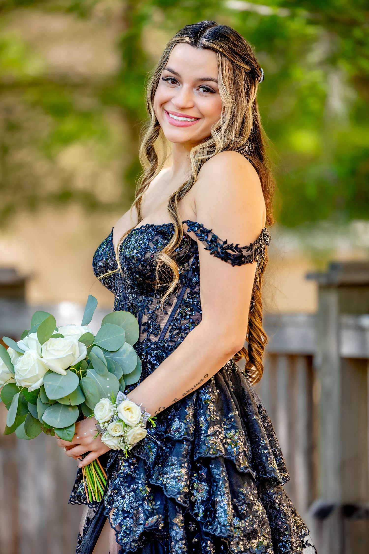 Elegant prom portrait with soft lighting, natural beauty, and graceful pose.