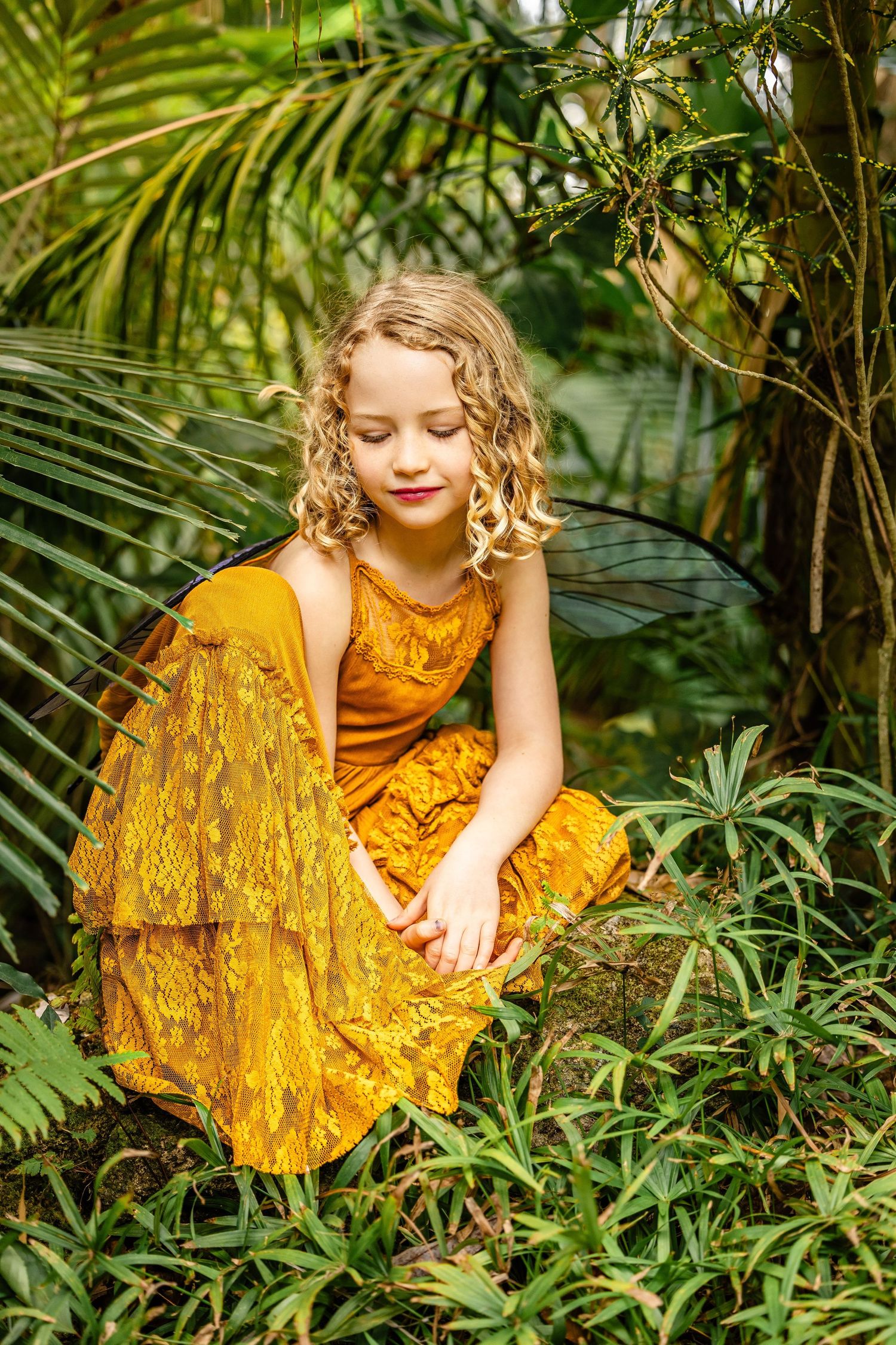 Magical fairy themed portrait surrounded by lush greenery and golden light at Leu Gardens Orlando