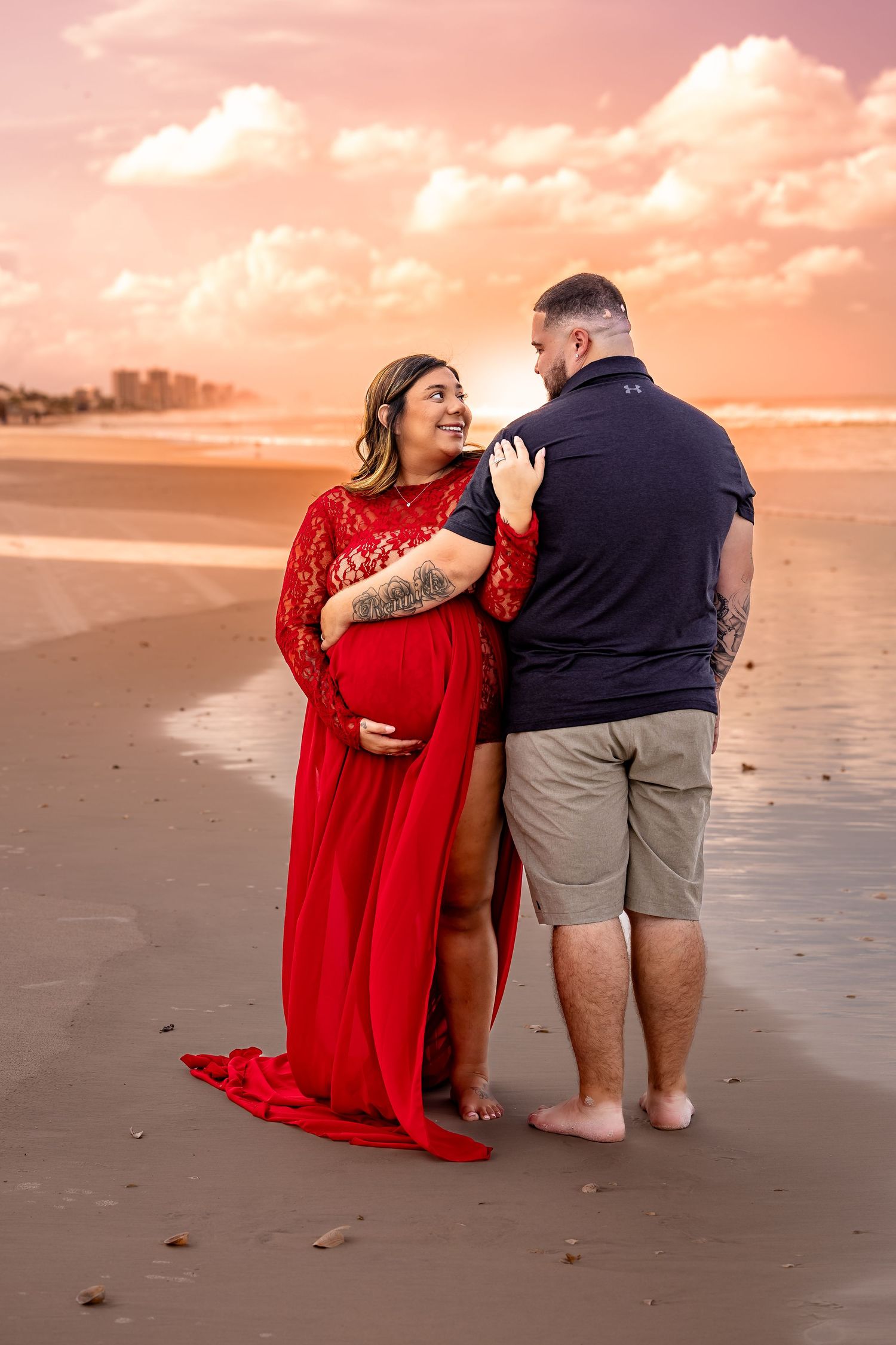 Sunset maternity session capturing love, anticipation, and golden-hour beauty by the ocean.