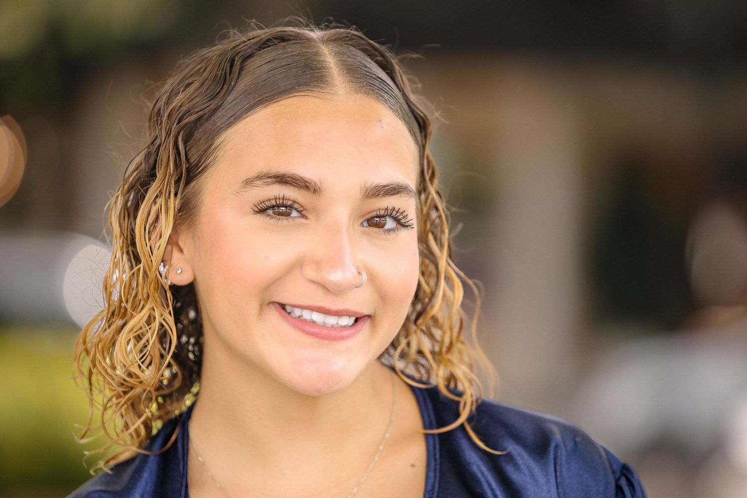 Bright senior portrait highlighting confidence, personality, and natural light