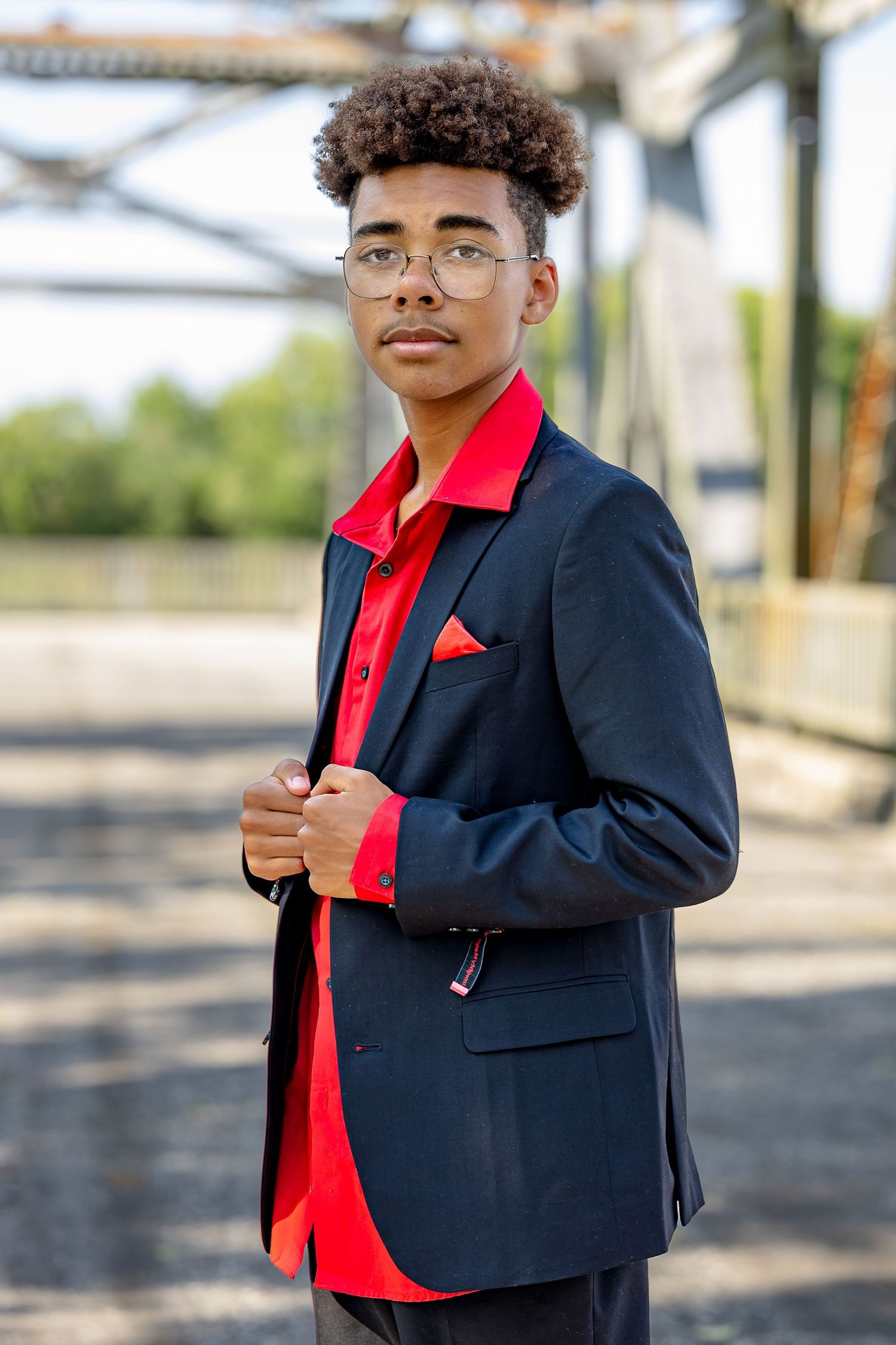 Modern teen photo with casual style, bold colors, and urban background.