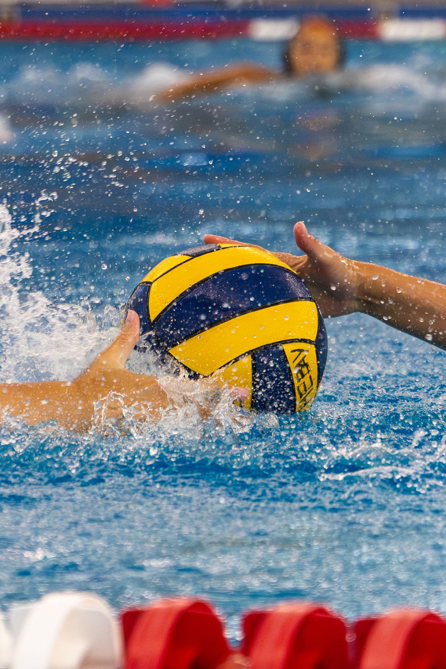 Water Polo ball between hands