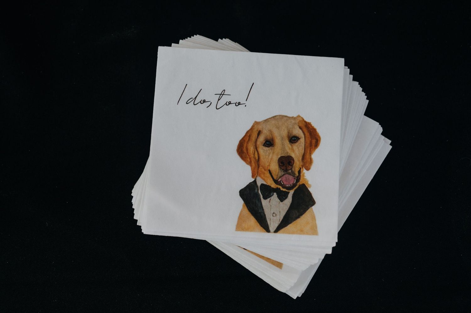 Golden retriever in tuxedo wedding cocktail napkins with I do too text for elegant dog-themed wedding reception.