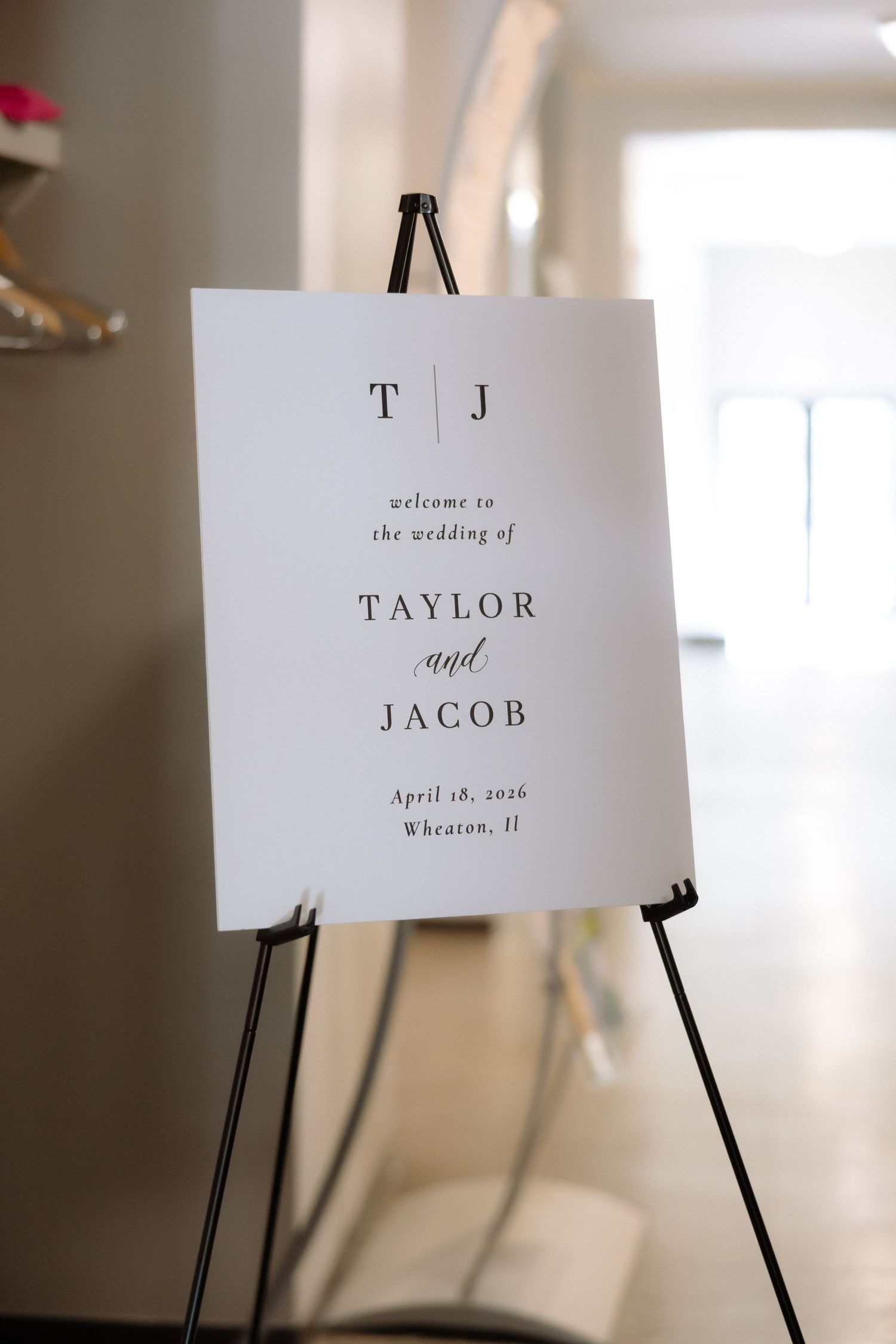 Elegant wedding welcome sign on easel for Taylor and Jacob, April 18, 2026, Wheaton, IL.