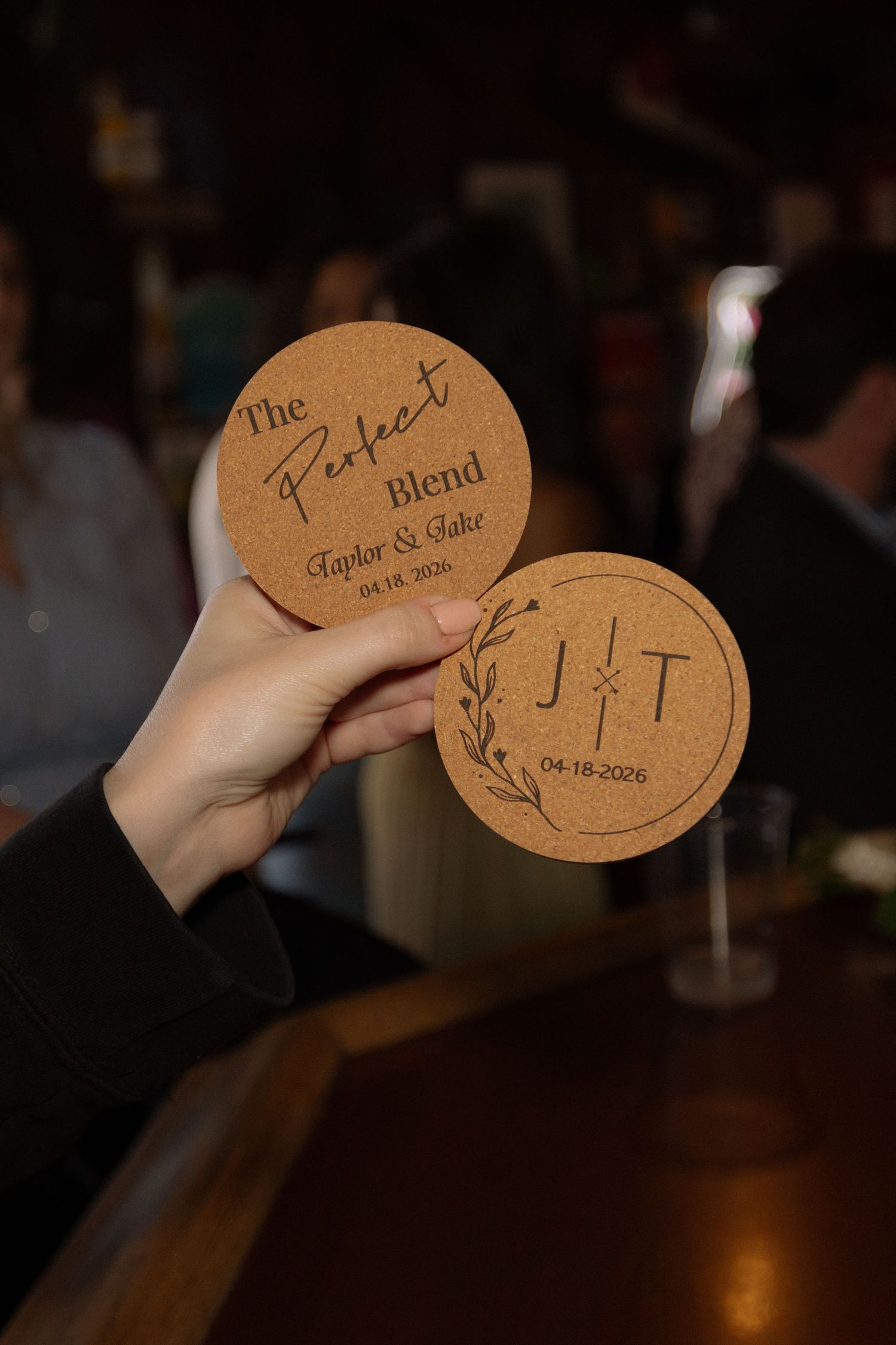 Two personalized cork coasters for Taylor and Jake wedding, reading The Perfect Blend with initials J and T, dated 04-18-2026.