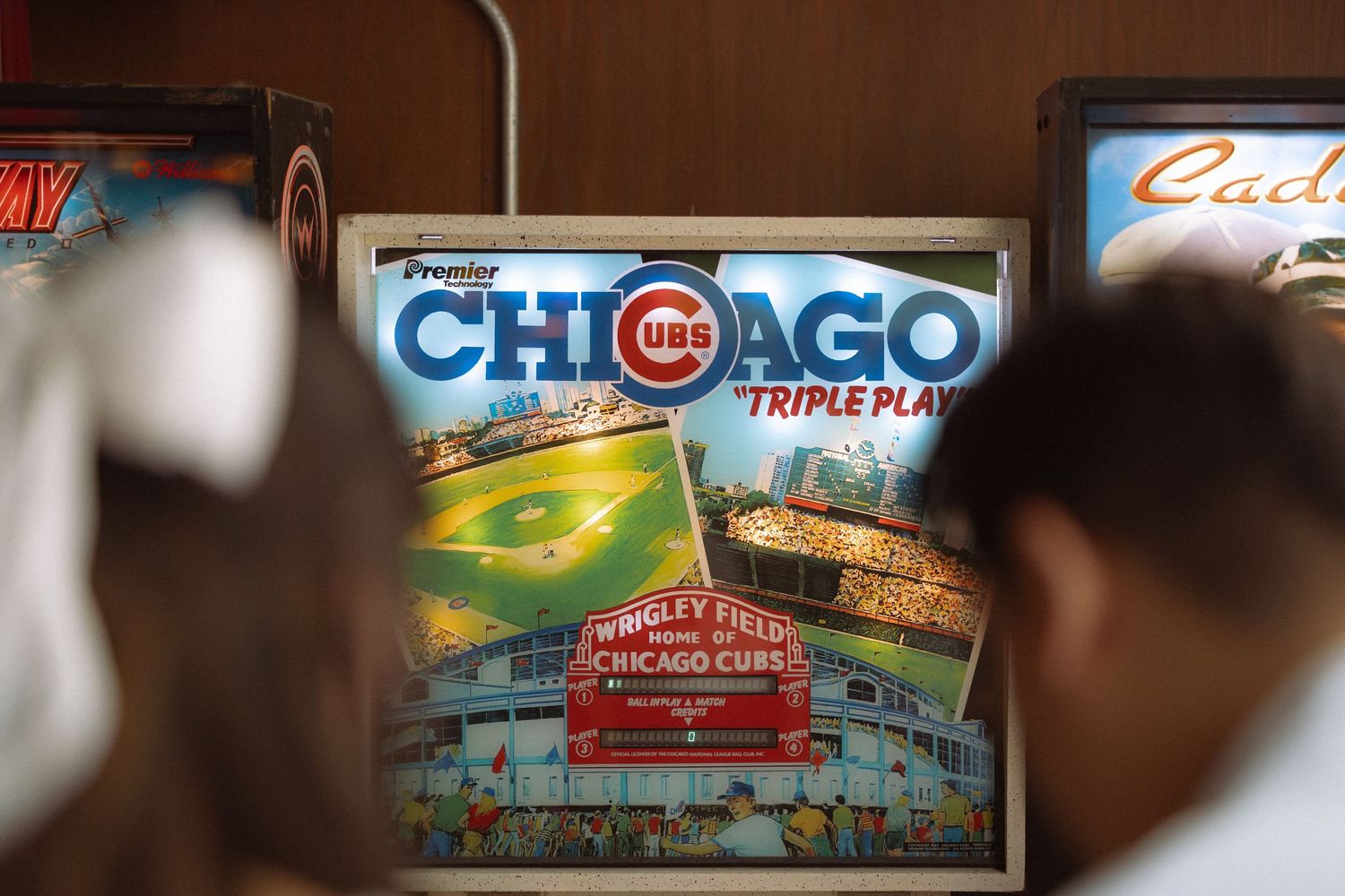 Close-up of a Chicago Cubs Triple Play pinball machine at Wrigley Field arcade game.