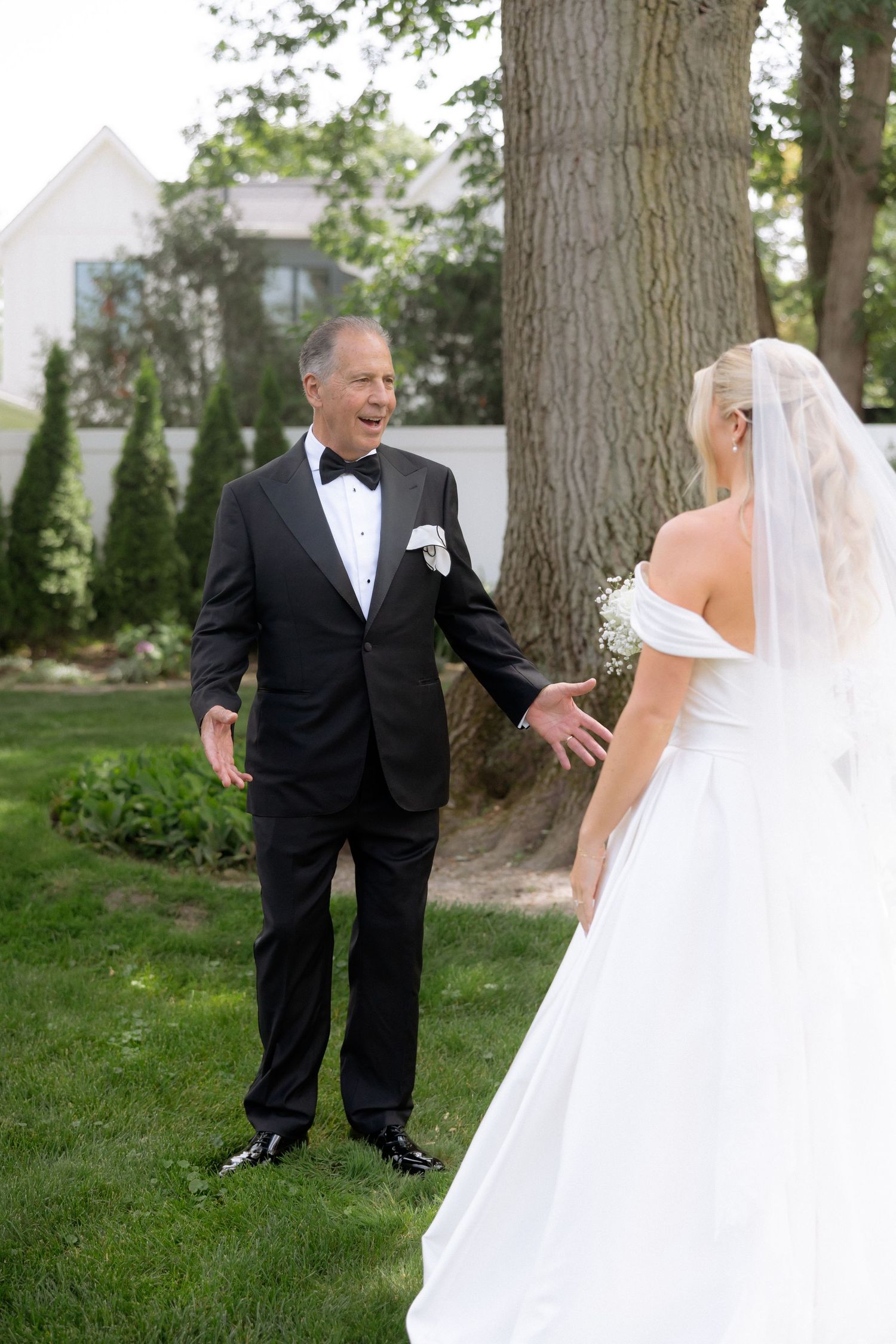 Father reacts with joy seeing his daughter in her wedding dress during an emotional first look.