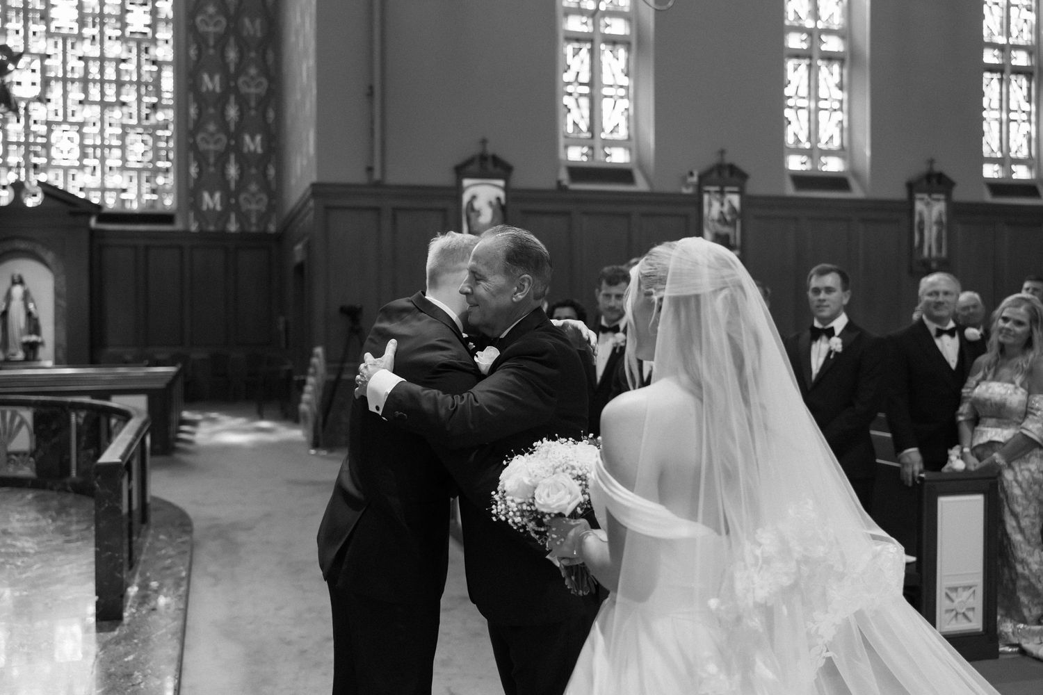 Bride and father share an emotional moment as he gives her away at the church altar.