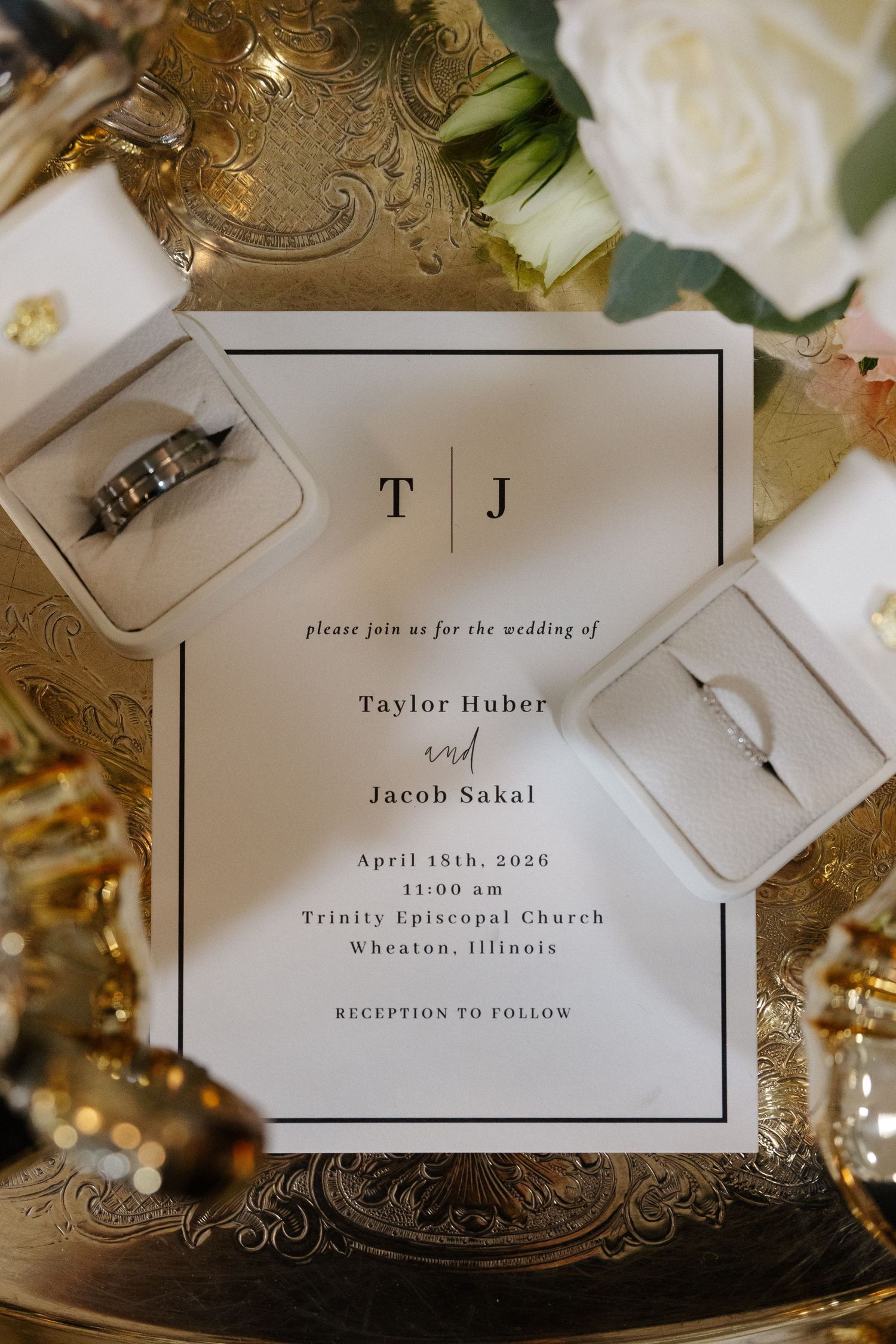 Elegant wedding invitation for Taylor Huber and Jacob Sakal on April 18th, 2026, at Trinity Episcopal Church in Wheaton, Illinois.