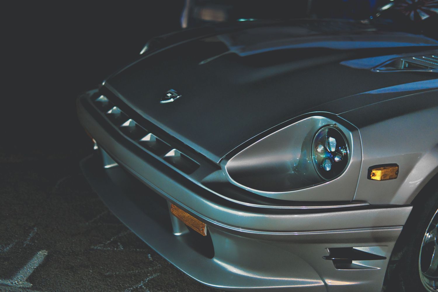 Datsun 280ZX parked at night.