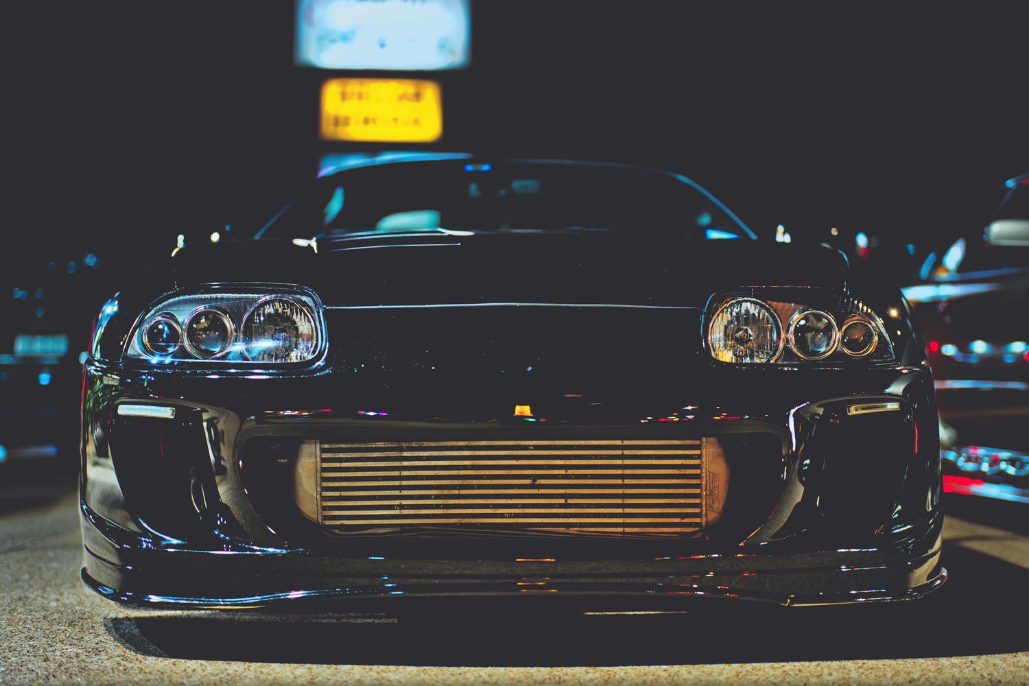 Toyota Supra MKIV parked at night time.