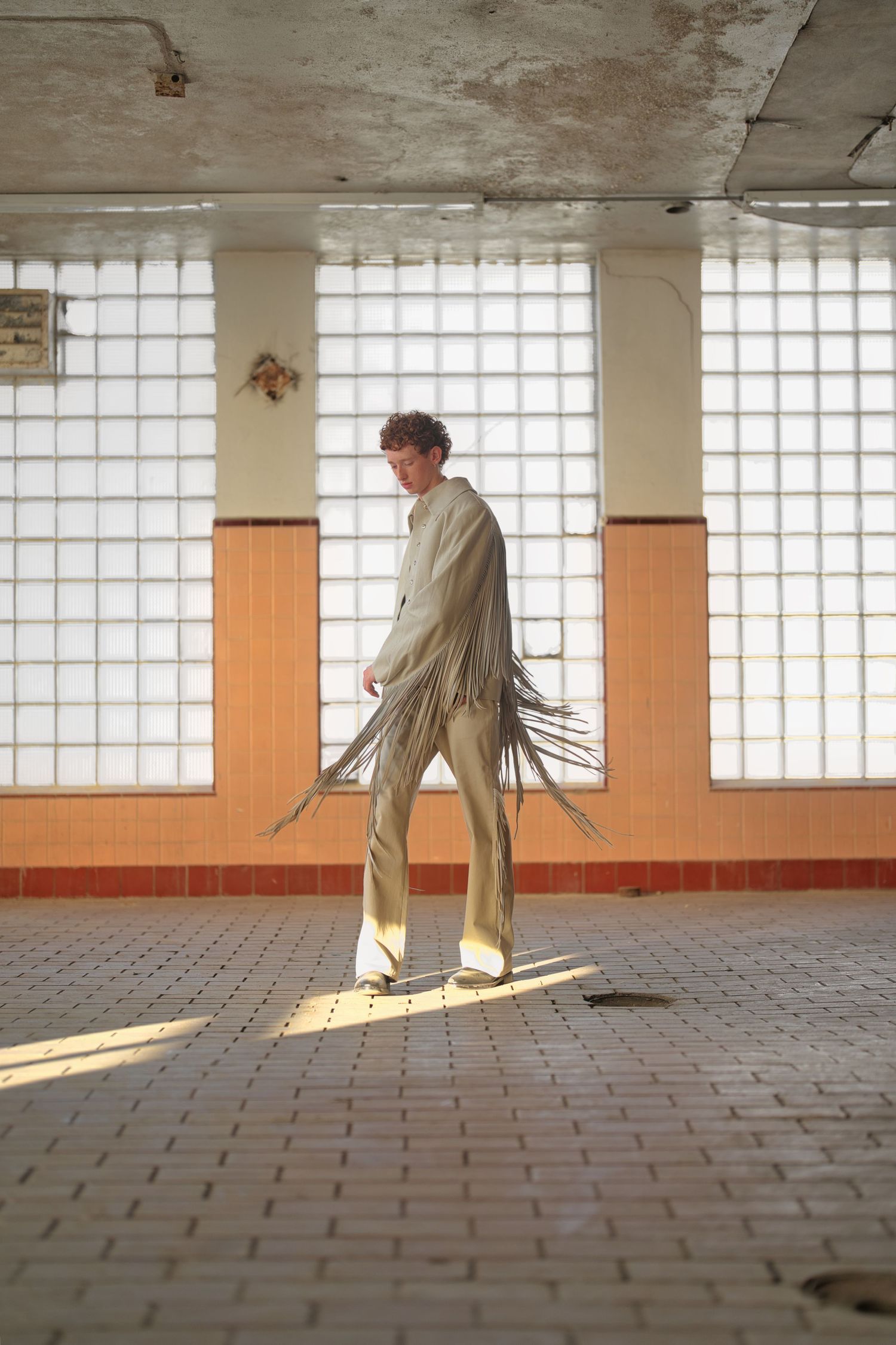 Man standing in middle of room.