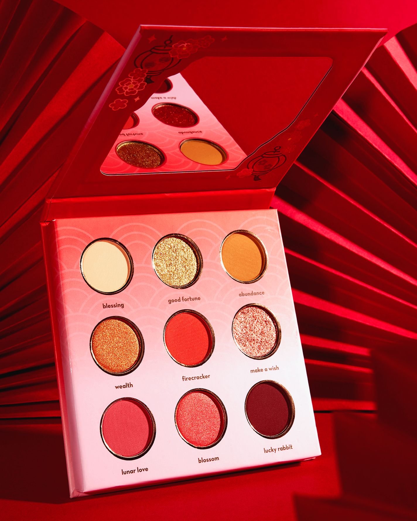 Red eyeshadow palette with 9 shades including blessing, good fortune, and lucky rabbit for a bold makeup look.