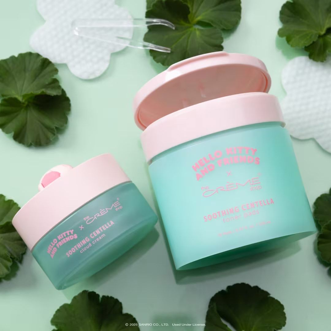 Two pink and mint green skincare cream jars with Centella extract on a green background with leaves.