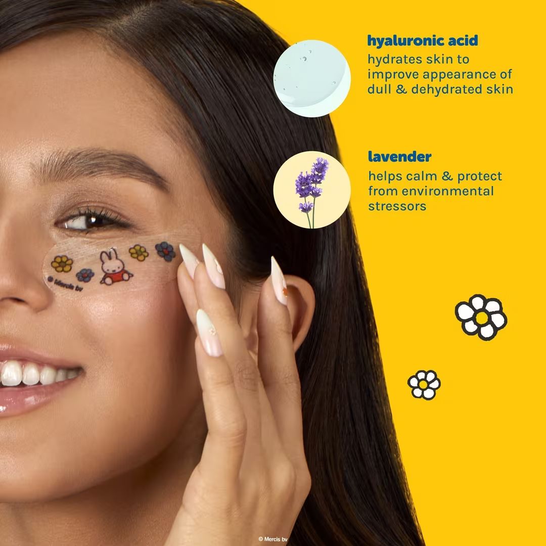 Woman applying hyaluronic acid and lavender eye patches to hydrate and calm skin against yellow background.
