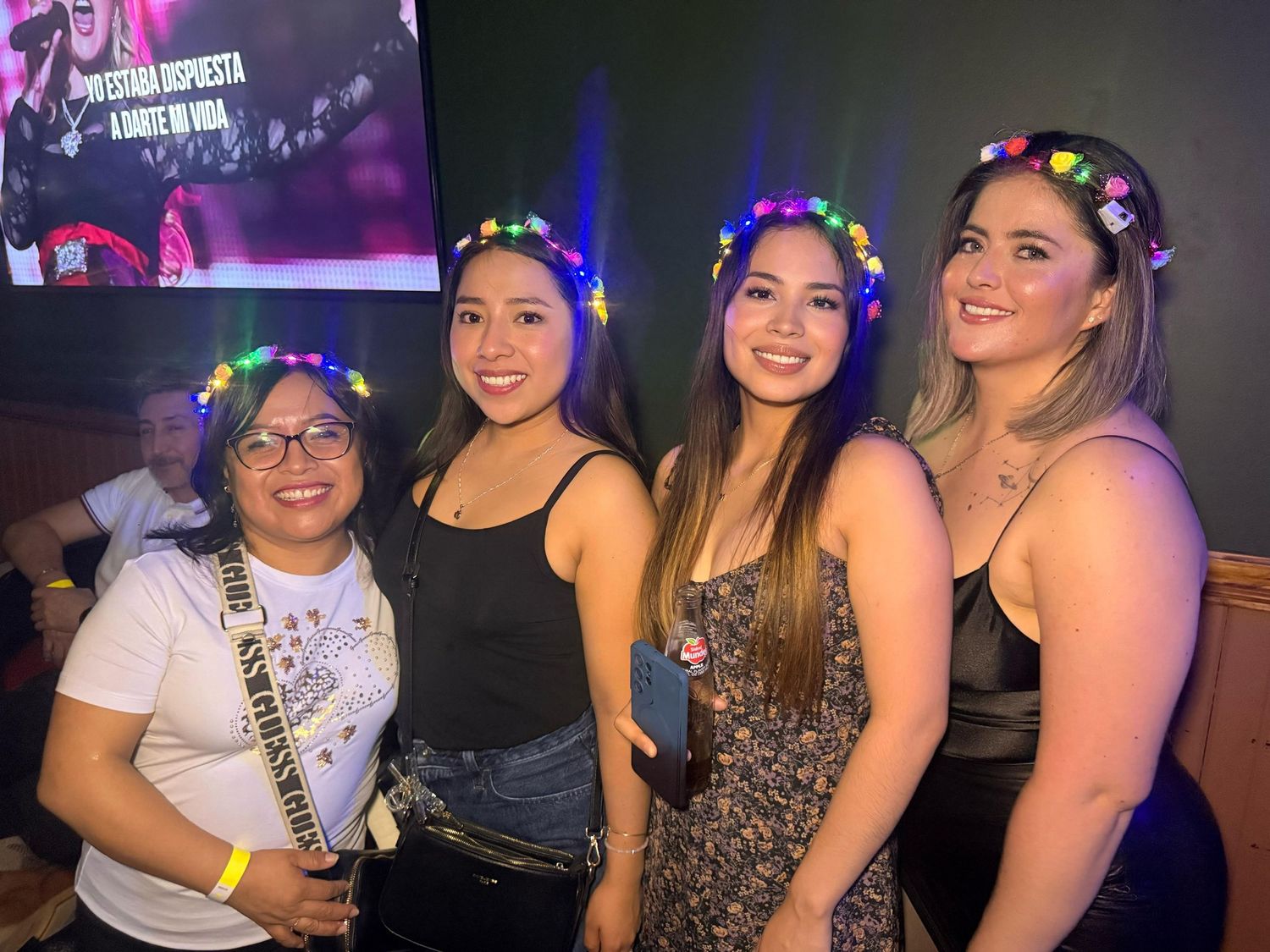 Party scene with colorful lighting and festive decorations at a nightclub.