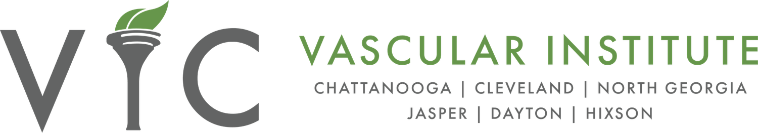 A modern green and gray medical office logo for the Vascular Institute featuring a stylized leaf design.