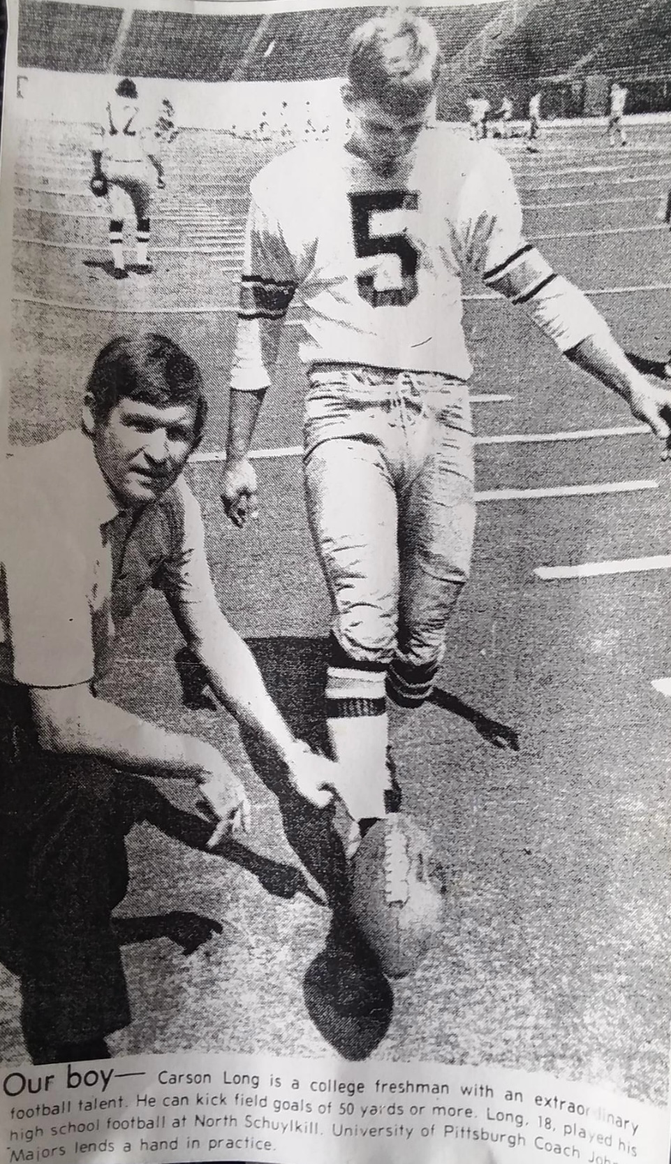 Carson Long, college freshman kicker #5, practices field goals with Pittsburgh Coal Majors coach at North Schuylkill.