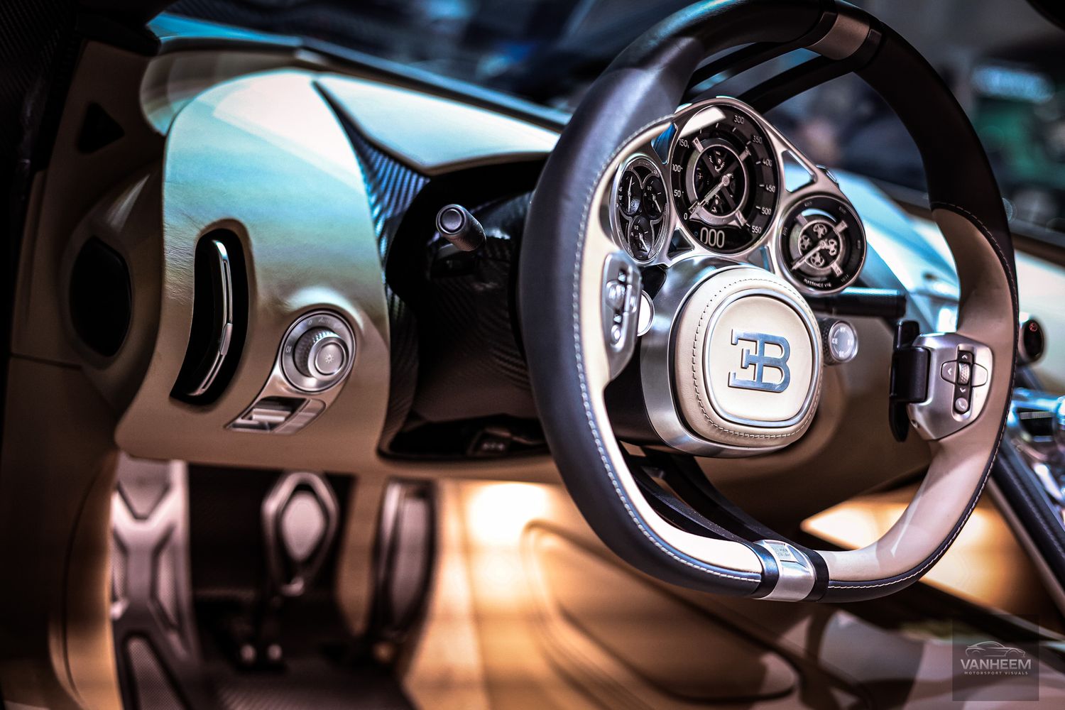 Close-up details of luxury car steering wheels and dashboard controls in dramatic lighting.