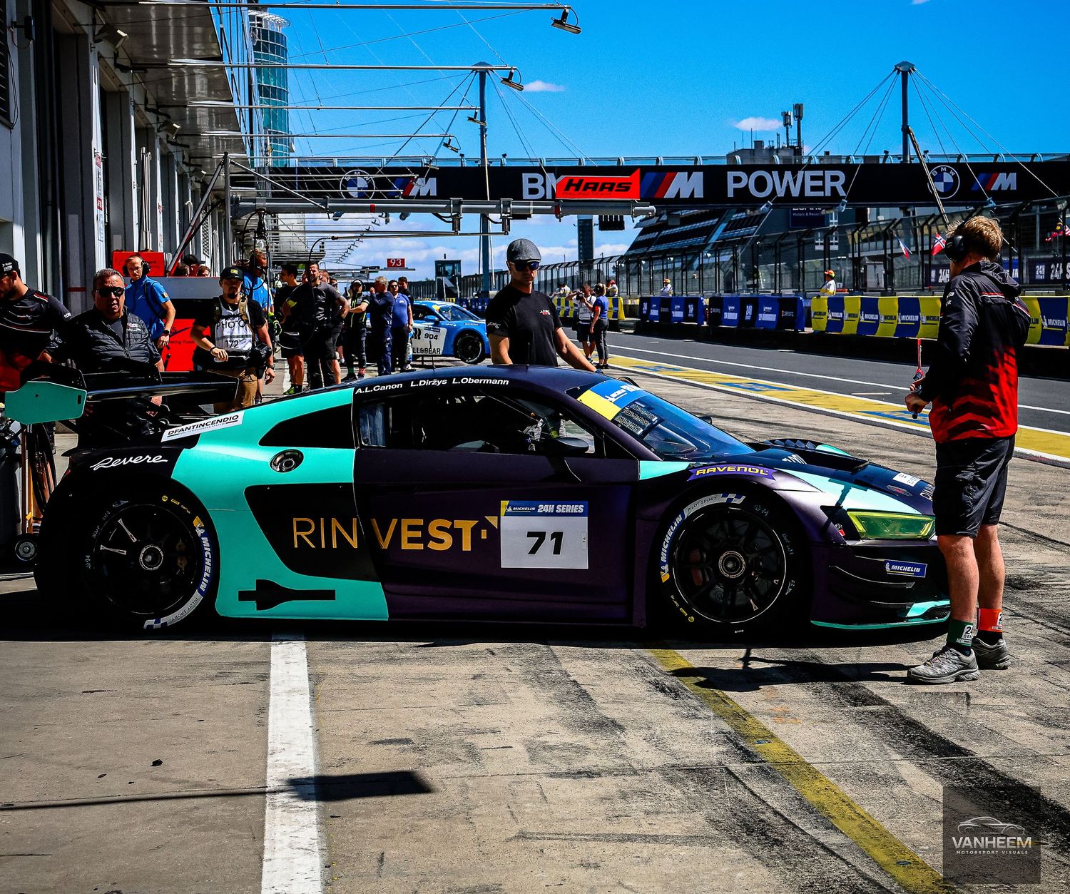 RIN VEST #71 Audi R8 GT3 race car in pit lane during motorsport event.