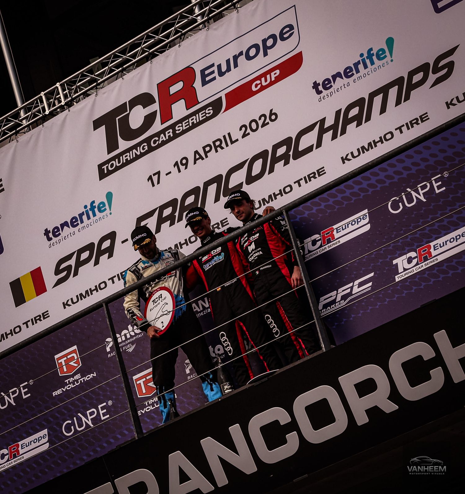 Three racing drivers celebrate on the TCR Europe Cup podium at Spa-Francorchamps, April 17-19, 2026.