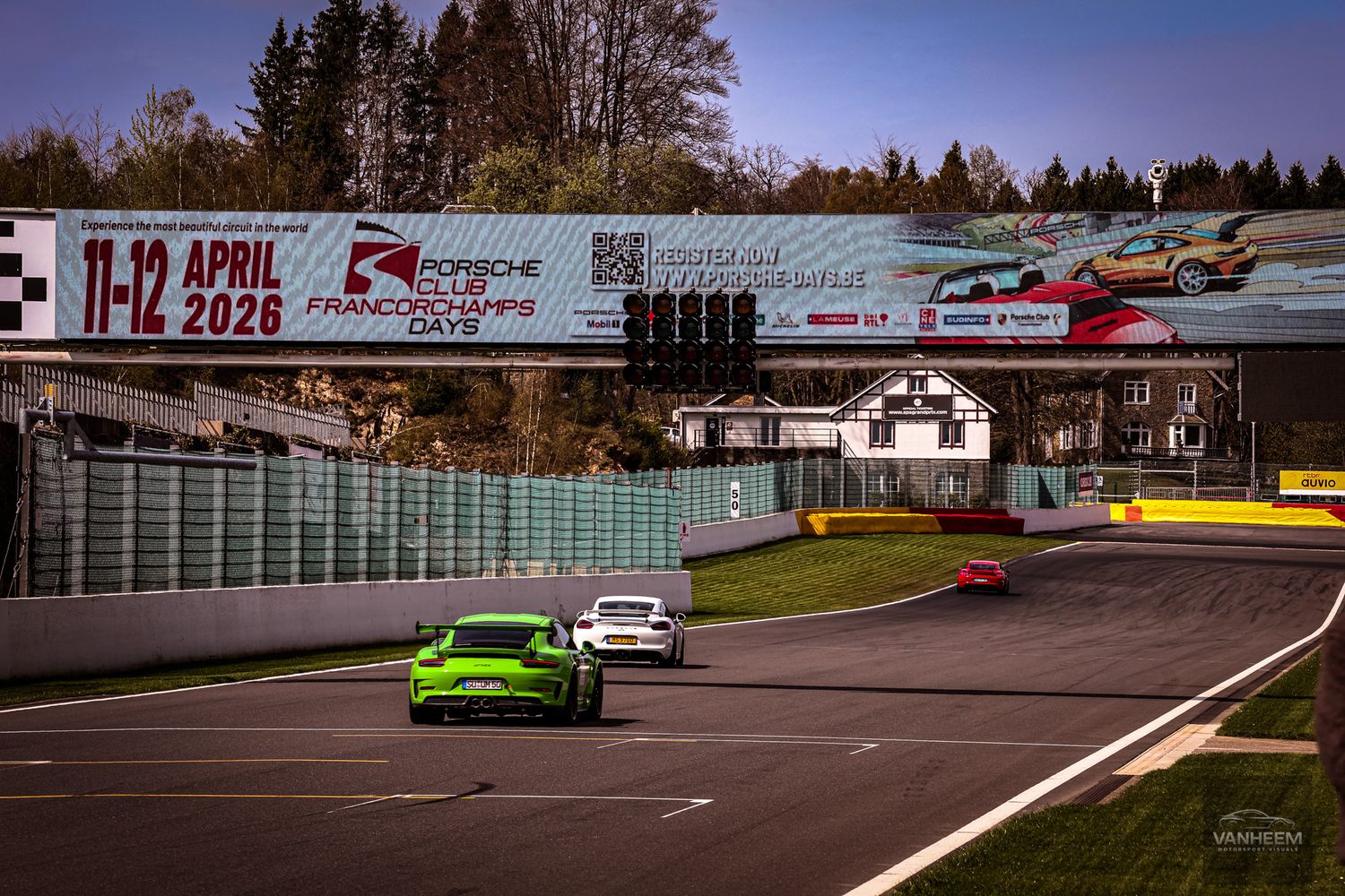 Green Porsche races on Spa-Francorchamps circuit during Porsche Championship Days, April 11-12 2026 event.