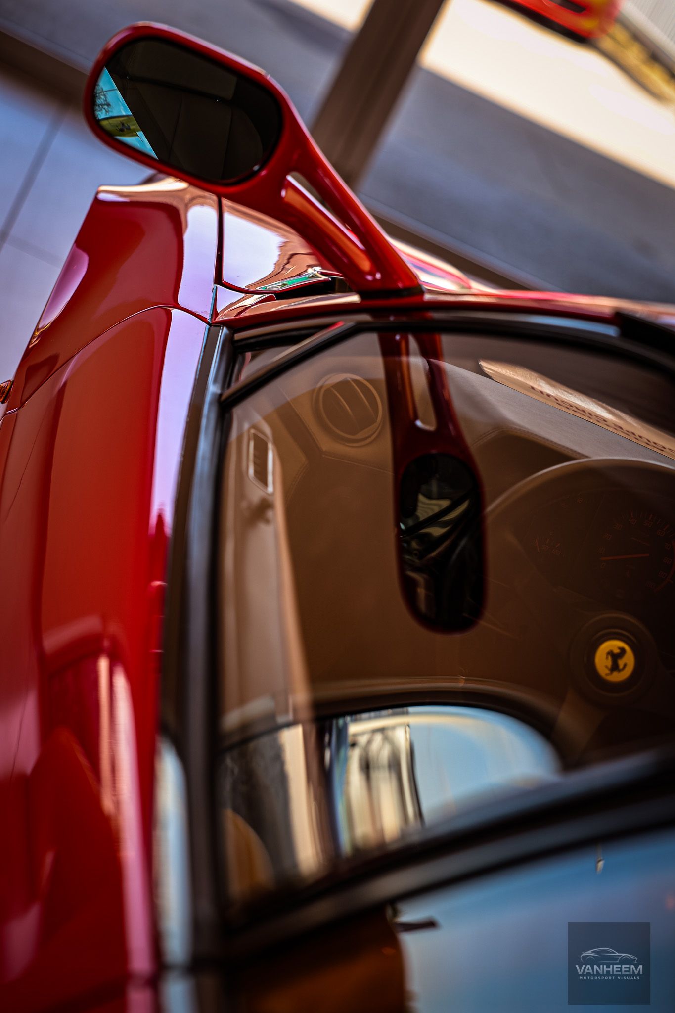 Interior detail shots of a red Ferrari showing door panel and window design.