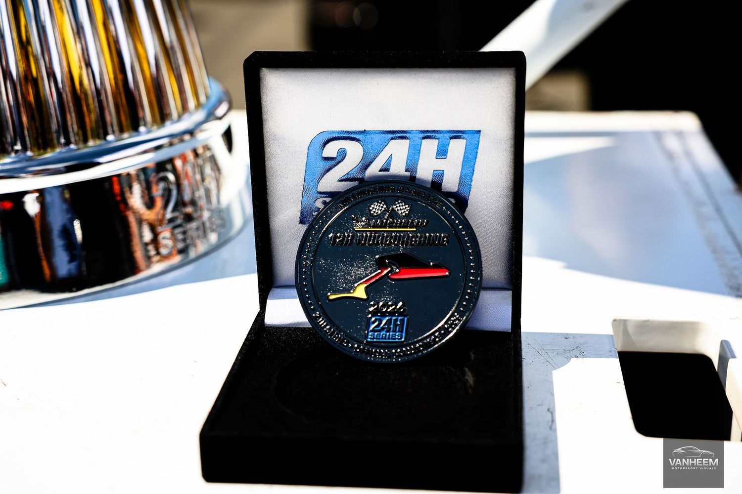 24H Le Mans commemorative medal displayed in a black velvet box at the iconic endurance racing event.