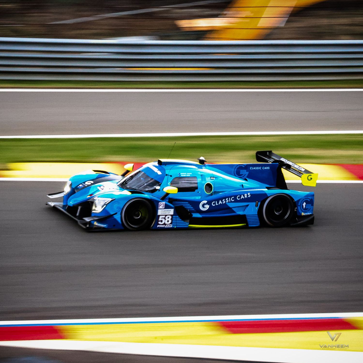 Blue #58 Classic Cars LMP racing car speeding on track at a motorsport endurance race event.