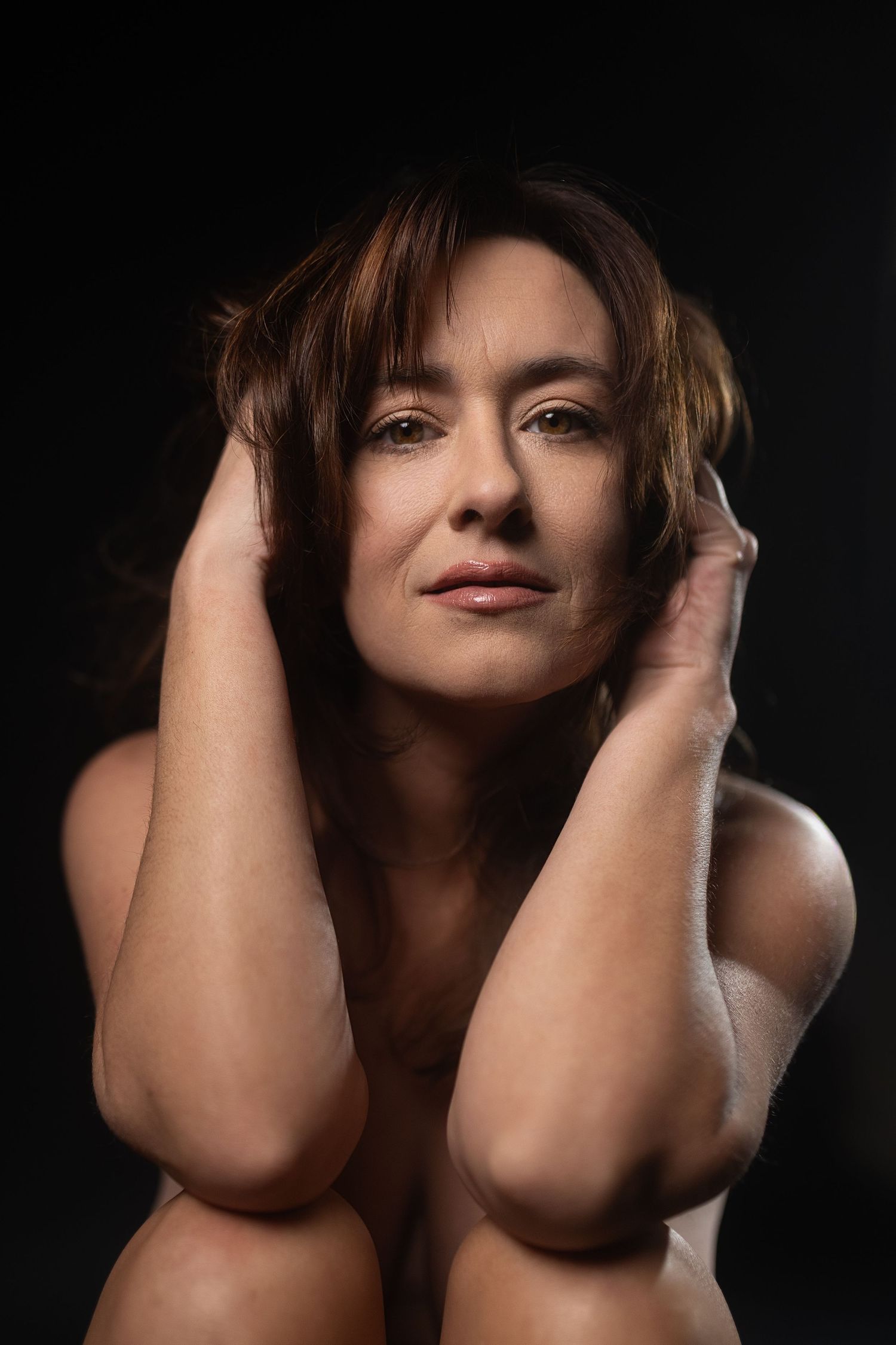 Close-up editorial portrait from one of the best boudoir photographers in Fort Worth featuring soft lighting and confident expression.