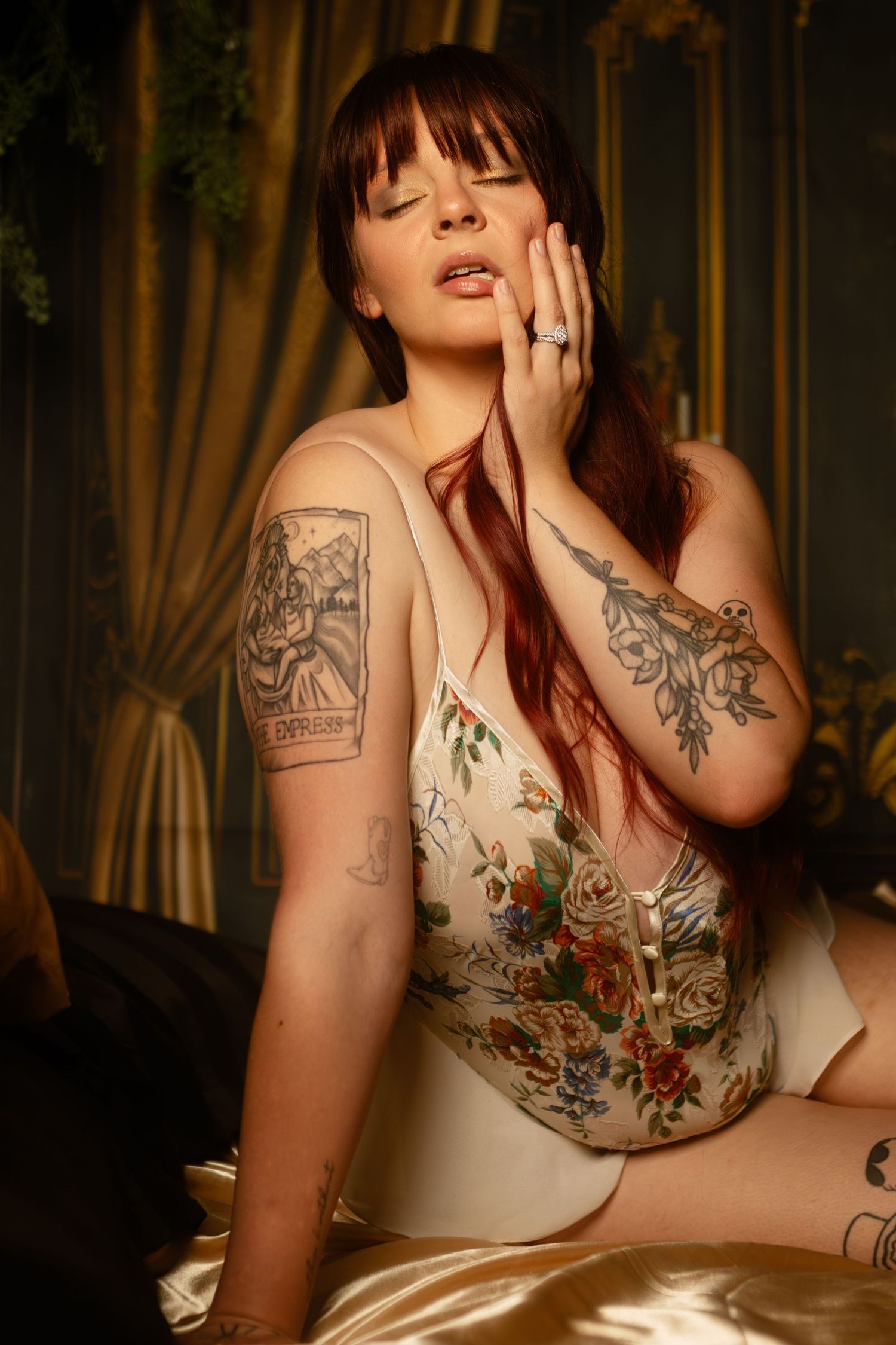 DFW boudoir portrait of tattooed woman in lace bodysuit, intimate and editorial style at Lock & Key Photography in Fort Worth.