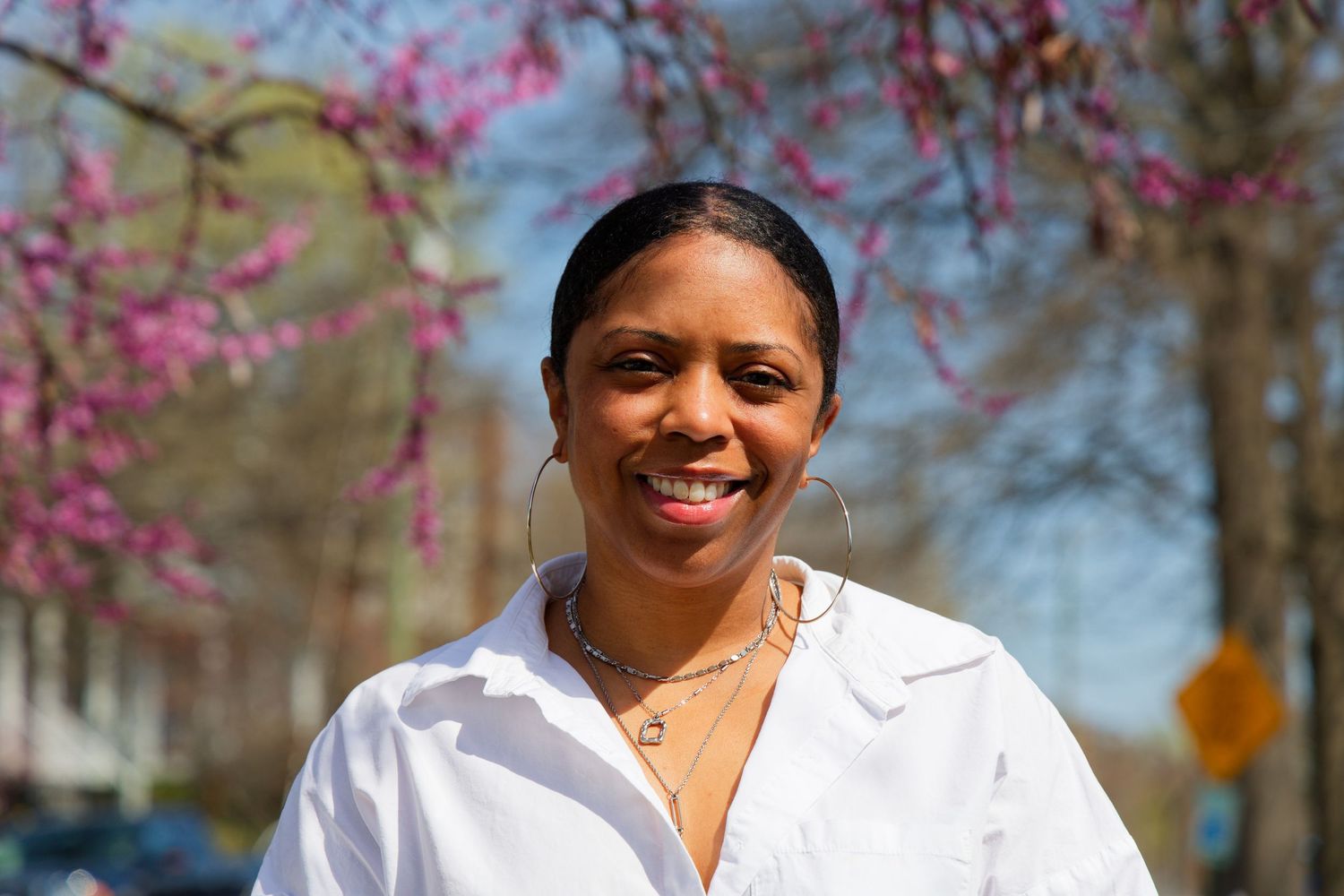 Portrait outdoors on a spring day with blooming trees in the background downtown Richmond, Virginia, RVA