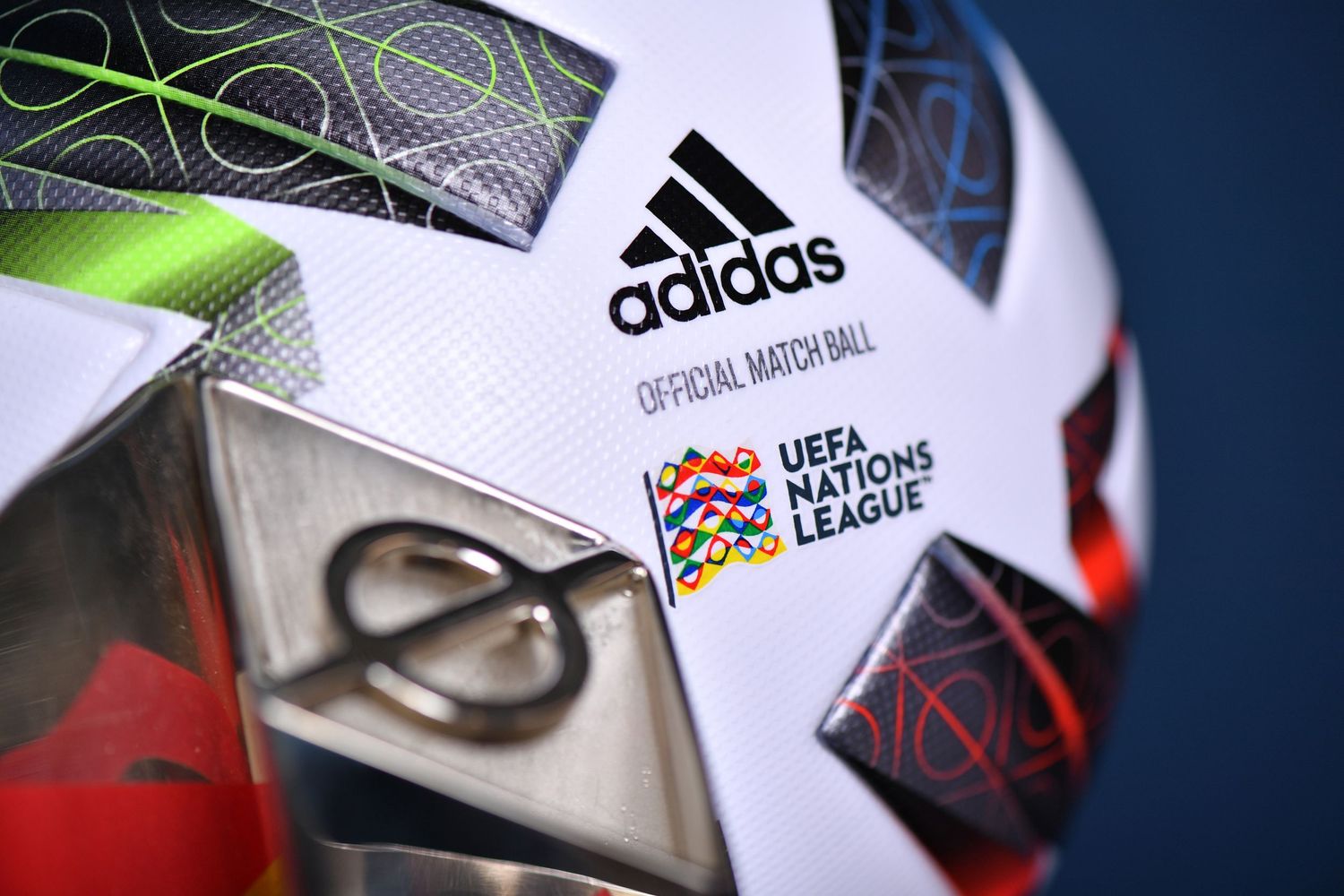 Adidas official UEFA Nations League match ball close-up showing logo and colorful design.